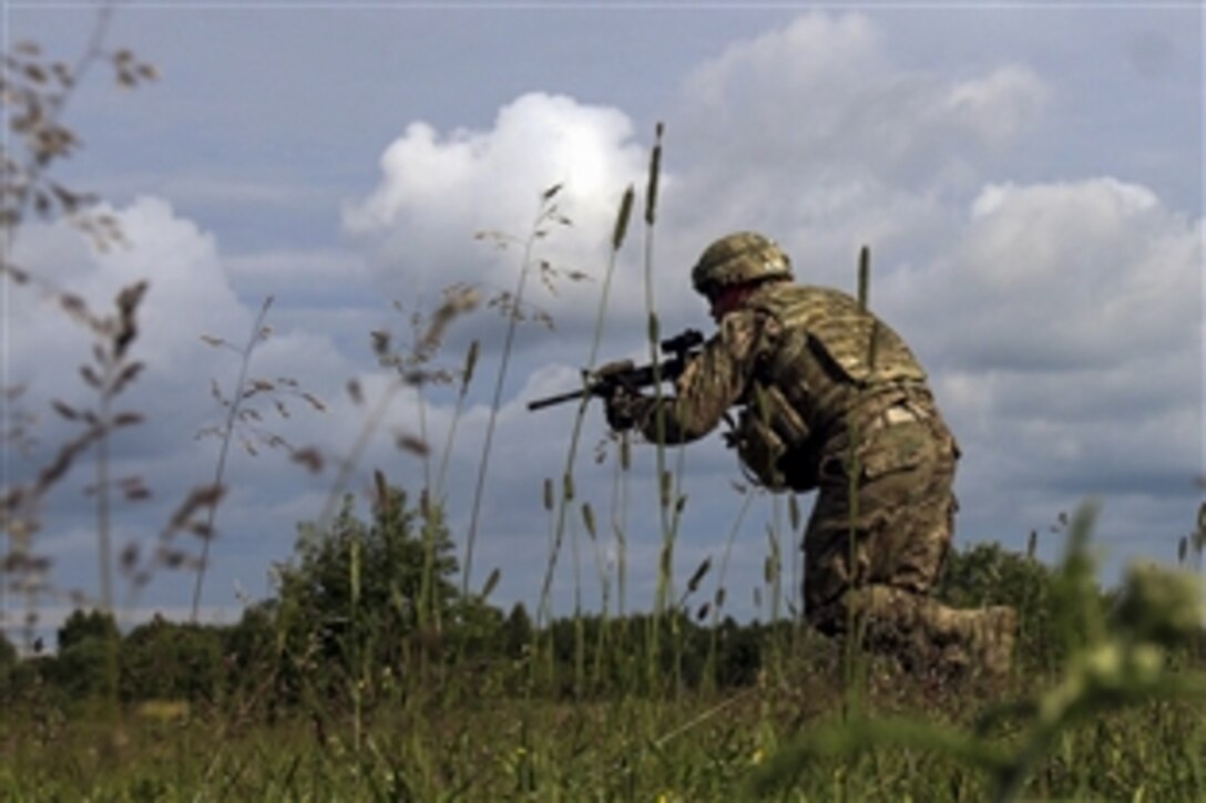 A U.S. soldier practices maneuvering movements to prepare for a live-fire exercise at Tapa, Estonia, June 30, 2015. The exercise combined the knowledge and skills of the U.S. and Estonian militaries as part of Operation Atlantic Resolve. The soldier is assigned to 173rd Airborne Brigade.