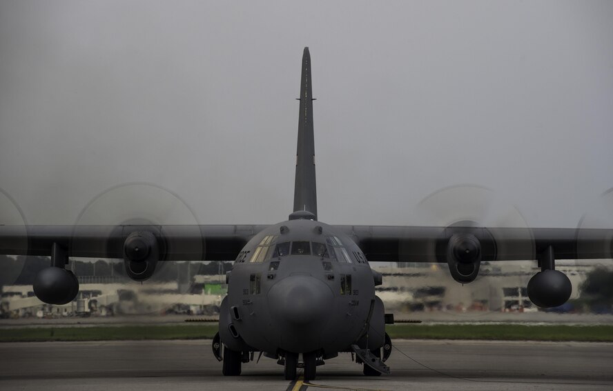 A modified C-130 Hercules assigned to the 910th Airlift Wing at Youngstown Air Reserve Station, Ohio, starts up on June 19, 2015, at Joint Base Charleston, S.C. The C-130 and aircrew sprayed to eradicate mosquitos on the Joint Base Charleston Weapons Station. The aerial spraying was performed at night to increase the chances of eliminating mosquitoes while reducing the risk of contaminating bees. (U.S. Air Force photo/Senior Airman Jared Trimarchi)