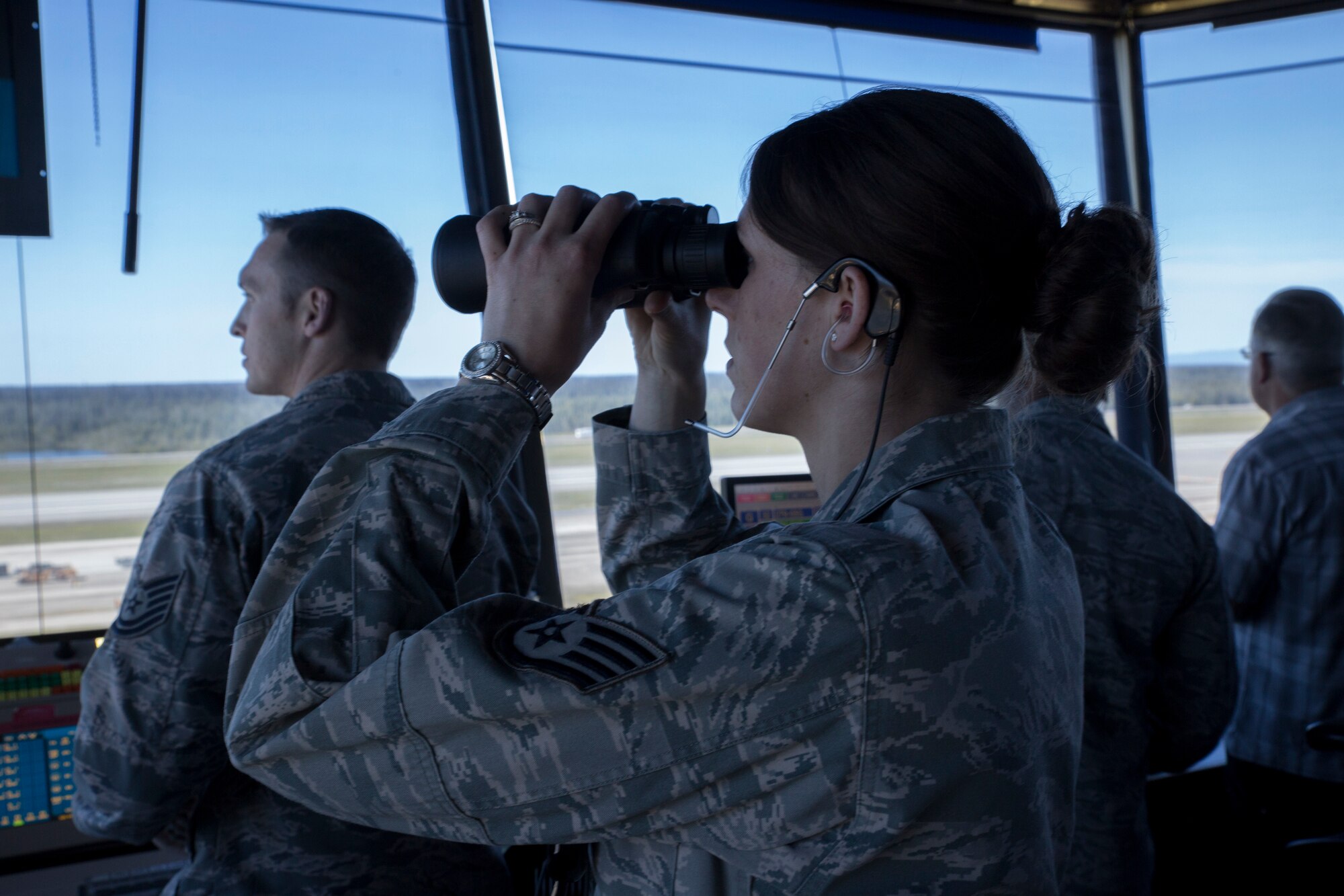 U.S. Air Force Staff Sgt. Kathleen A. Peck, an air traffic control watch supervisor with the 354th Operations Support Squadron, works in the air traffic control tower on Eielson Air Force Base, Alaska, during Northern Edge, June 17, 2015. Northern Edge 2015 is Alaska’s premier joint training exercise designed to practice operations, tactics, techniques and procedures as well as enhance interoperability among the services. Thousands of Airmen, Soldiers, Sailors, Marines and Coast Guardsmen from active-duty, Reserve and National Guard Units are involved. (U.S. Marine Corps photo by Cpl. Thor J. Larson/Released)
