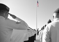Members of the 747th Communications Squadron salute the U.S. flag during a Reveille ceremony on Joint Base Pearl Harbor-Hickam, Hawaii, July 2, 2015.The ceremony was performed by 60 Airmen from the 747th in honor of Independence Day. (U.S. Air Force graphic by Tech. Sgt. Aaron Oelrich by Released) 