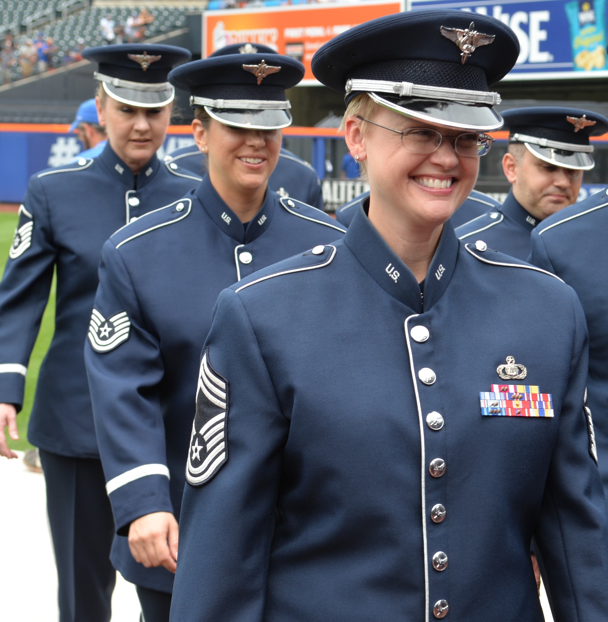 Members of the Air Force Singing Sergeants are all smiles after performing the National Anthem at New York City's Citi Field on July 2, 2015. This performance was part of a larger five-day tour in New York City to represent the Air Force on the nation's birthday (U.S. Air Force photo/1Lt. Esther Willett).