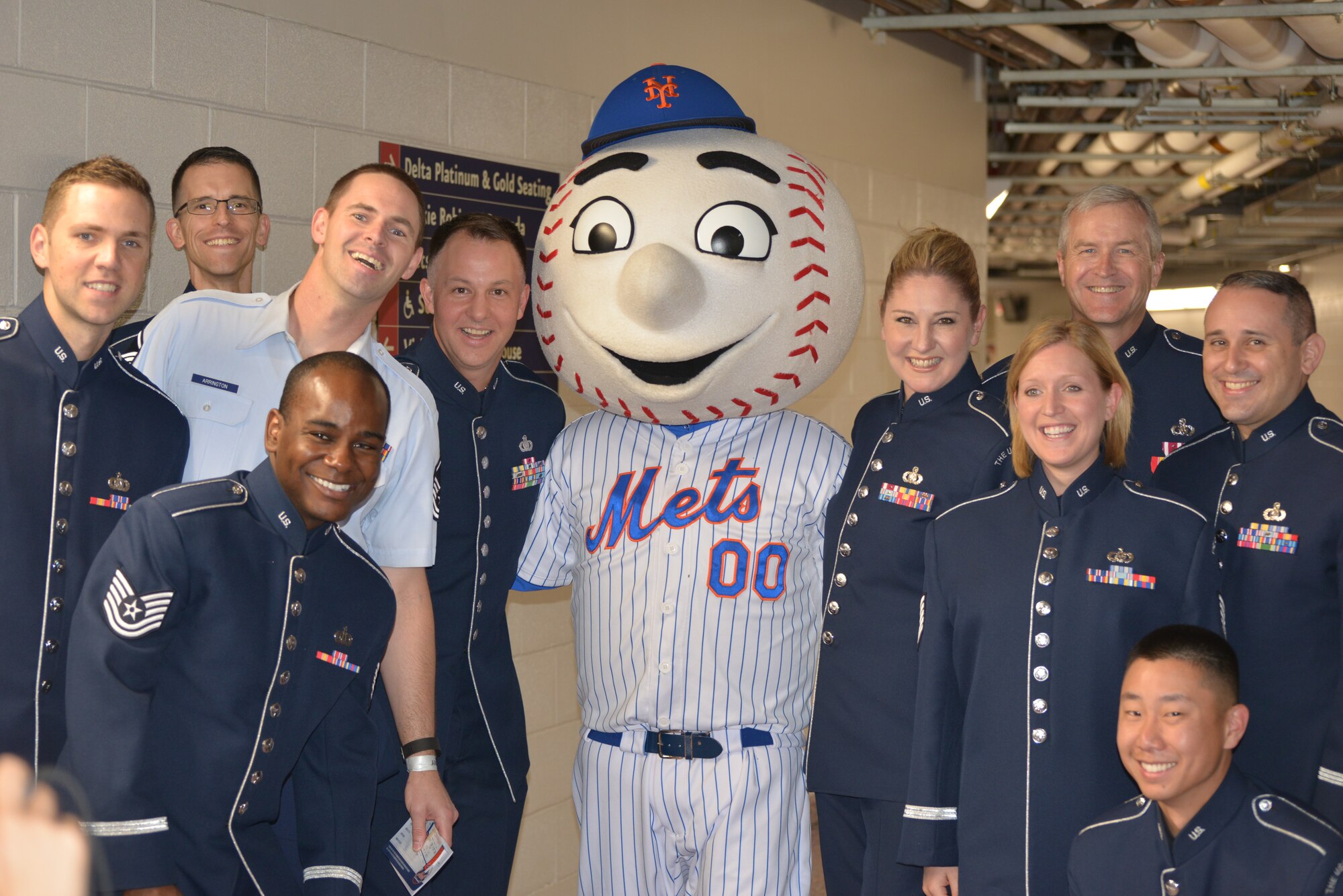 Members of the Singing Sergeants pose with Mr. Met below New York City's Citi Field on July 2, 2015. The Singing Sergeants performed the National Anthem before the Mets’ game. This performance was part of a larger five-day tour in New York City to represent the Air Force on the nation's birthday (U.S. Air Force photo/1Lt. Esther Willett).