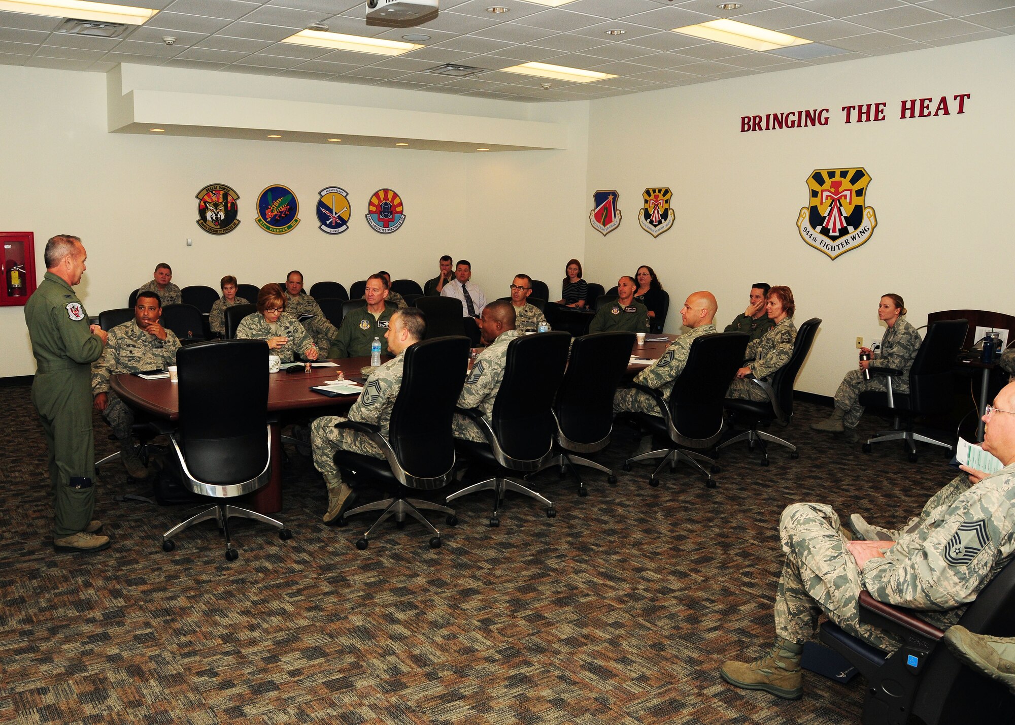 Col. Kurt Gallegos, 944th Fighter Wing commander, welcomes Air Force Reserve Command senior leaders before the Air Force Continuous Process Improvement (AF CPI) senior leaders course gets underway at the 944th FW conference room, Luke Air Force Base, Ariz. (U.S. Air Force photo by Tech. Sgt. Louis Vega Jr.)