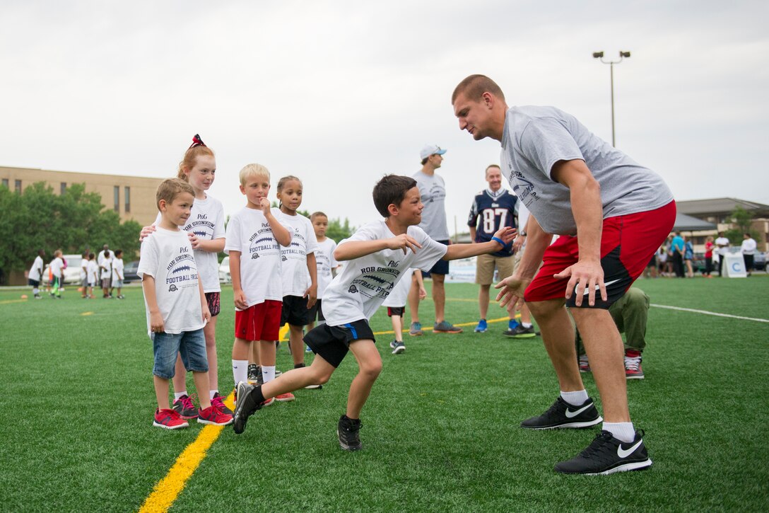 Rob Gronkowski, New England Patriots tight end, runs football drills with participants of a ProCamps event on Joint Base Andrews, Md., July 2, 2015. Gronkowski, a three time Pro Bowler and Super Bowl XLIX champion, coached approximately 100 military children during the two-day football camp. (U.S. Air Force photo/Tech. Sgt. Robert Cloys)