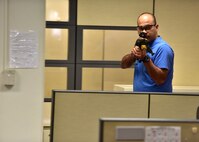 An 'active-shooter' walks through the Personnel Support Detachment building during an exercise held July 1, 2015 off-base at the Personnel Support Detachment Building. The exercise tested the JBPHH security department and HPD's response capabilities during an active shooter scenario. (U.S. Air Force photo by Senior Airman Christopher Stoltz/Released)