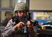 Senior Airman Trent Luckey, 647th Security Forces Squadron patrolman, surveys the area after his team apprehends a suspect during an active shooter training exercise, held July 1, 2015 off-base at the Personnel Support Detachment Building. The exercise tested the JBPHH security department and HPD's response capabilities during an active shooter scenario. (U.S. Air Force photo by Senior Airman Christopher Stoltz/Released)