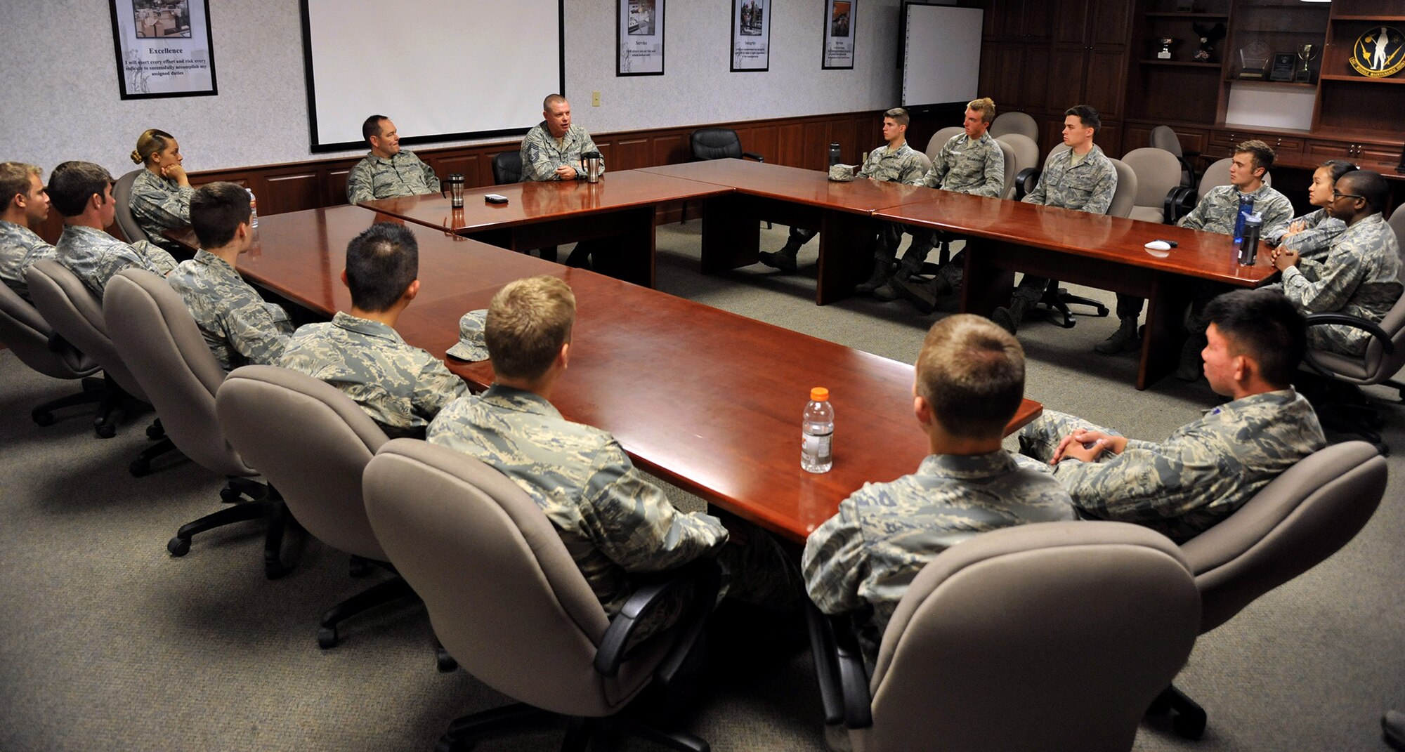 Chief Master Sgts. Robert Rasmussen and Phillip LeMaitre, 341st Maintenance Group squadron superintendents, center, discuss career development and leadership responsibilities with 20 Air Force Academy and Reserve Officer Training Corps cadets July 1, 2015. The cadets visited Malmstrom Air Force Base, Mont., as part of Operation Air Force, a summer program that allows cadets to interact with active-duty Airmen and explore career opportunities. (U.S. Air Force photo/John Turner)