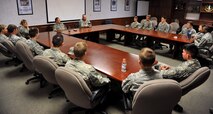 Chief Master Sgts. Robert Rasmussen and Phillip LeMaitre, 341st Maintenance Group squadron superintendents, center, discuss career development and leadership responsibilities with 20 Air Force Academy and Reserve Officer Training Corps cadets July 1, 2015. The cadets visited Malmstrom Air Force Base, Mont., as part of Operation Air Force, a summer program that allows cadets to interact with active-duty Airmen and explore career opportunities. (U.S. Air Force photo/John Turner)
