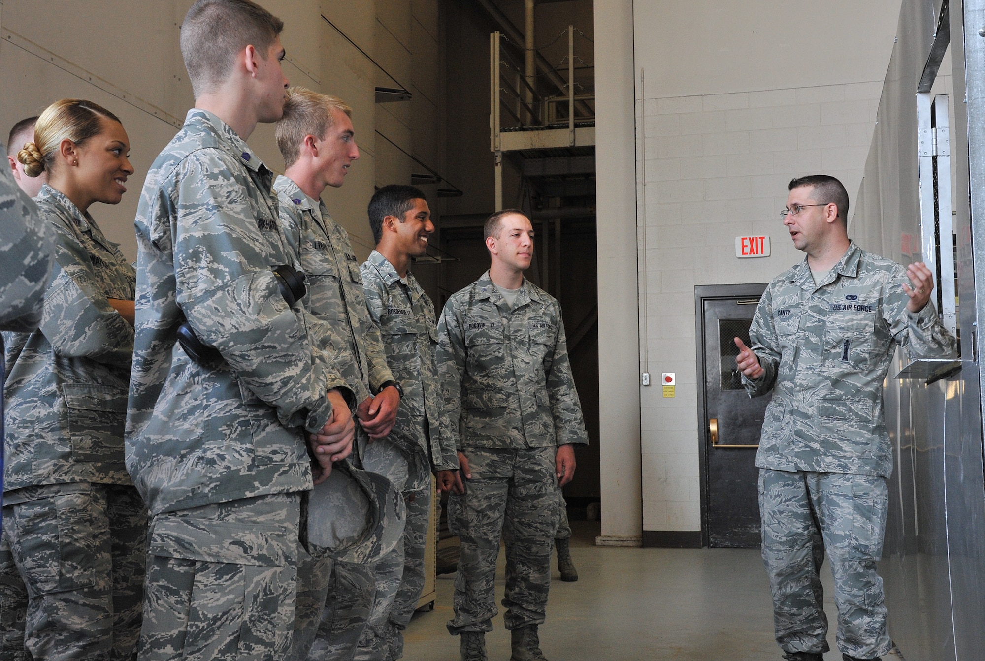 Staff Sgt. Blaine Canty, 341st Maintenance Operations Squadron vehicles and equipment section scheduler, right, describes vehicle check-out procedures to Air Force Academy and Reserve Officer Training Corps cadets July 1, 2015, at Malmstrom Air Force, Mont. The cadets visited the base as part of Operation Air Force, a summer program that allows cadets to interact with active-duty Airmen and explore career opportunities. (U.S. Air Force photo/John Turner)