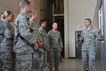 Staff Sgt. Blaine Canty, 341st Maintenance Operations Squadron vehicles and equipment section scheduler, right, describes vehicle check-out procedures to Air Force Academy and Reserve Officer Training Corps cadets July 1, 2015, at Malmstrom Air Force, Mont. The cadets visited the base as part of Operation Air Force, a summer program that allows cadets to interact with active-duty Airmen and explore career opportunities. (U.S. Air Force photo/John Turner)