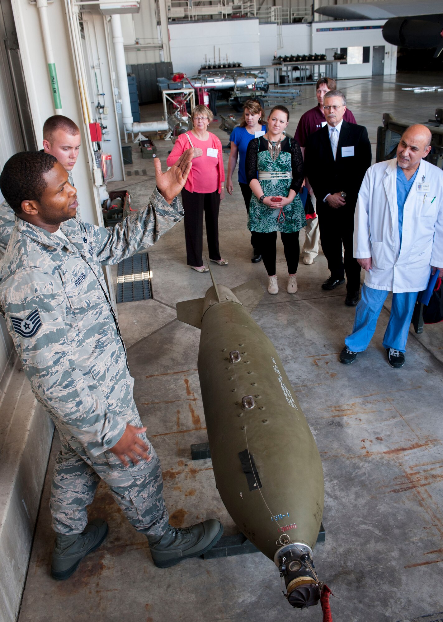 Local physicians from Trinity Hospital view munitions that are carried by B-52H Stratofortress’ during the 5th Medical Group open house event at Minot Air Force Base, N.D., June 26, 2015. During the tour the group learned that the B-52H is one of the only aircraft in the military capable of carrying such a wide array of munitions. (U.S. Air Force photo/Senior Airman Stephanie Morris)
