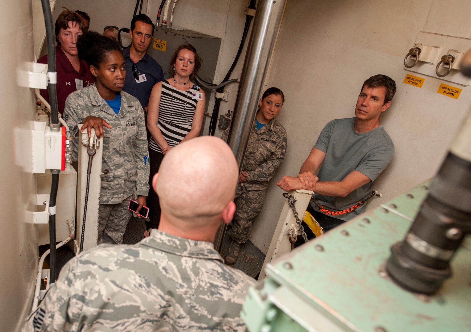 Local physicians from Trinity Hospital tour the Uniform 01 missile trainer during a one-day 5th Medical Group open house at Minot Air Force Base, N.D., June 26, 2015. Providers from several different offices within trinity attended the tour. (U.S. Air Force photo/Senior Airman Stephanie Morris)