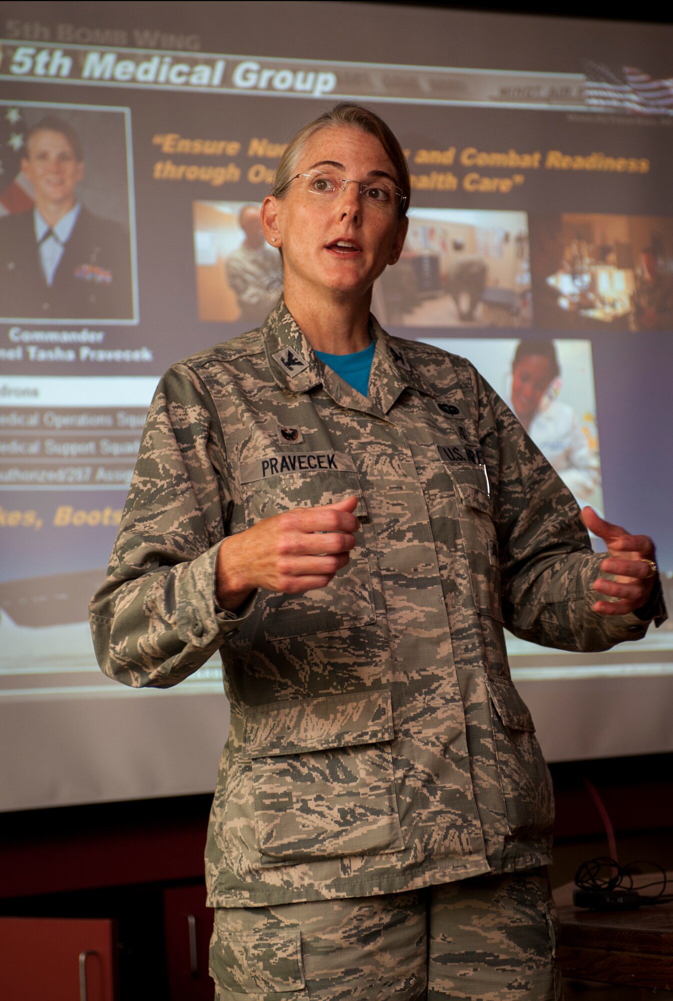 Col. Tasha Pravecek, 5th Medical Group commander, speaks to a group of local physicians during 5th Medical Group open house event at Minot Air Force Base, N.D., June 26, 2015. During her speech, Pravecek talked about the importance of the relationship between downtown and on-base medical personnel in providing top-notch medical care for Airmen and their families. (U.S. Air Force photo/Senior Airman Stephanie Morris)