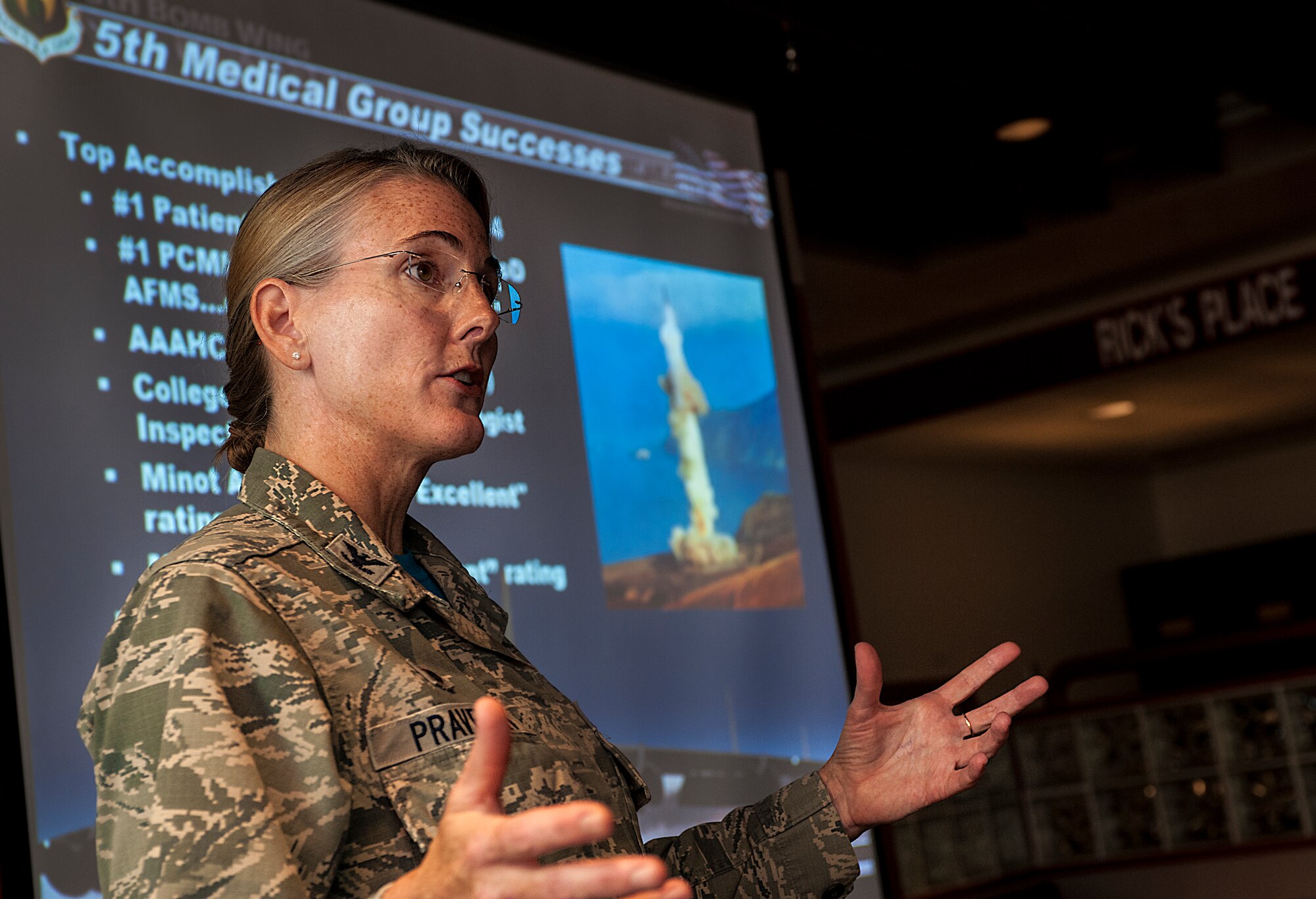 Col. Tasha Pravecek, 5th Medical Group commander, speaks to a group of local physicians during 5th Medical Group open house event at Minot Air Force Base, N.D., June 26, 2015. During her speech, Pravecek talked about the importance of the relationship between downtown and on-base medical personnel in providing top-notch medical care for Airmen and their families. (U.S. Air Force photo/Senior Airman Stephanie Morris)