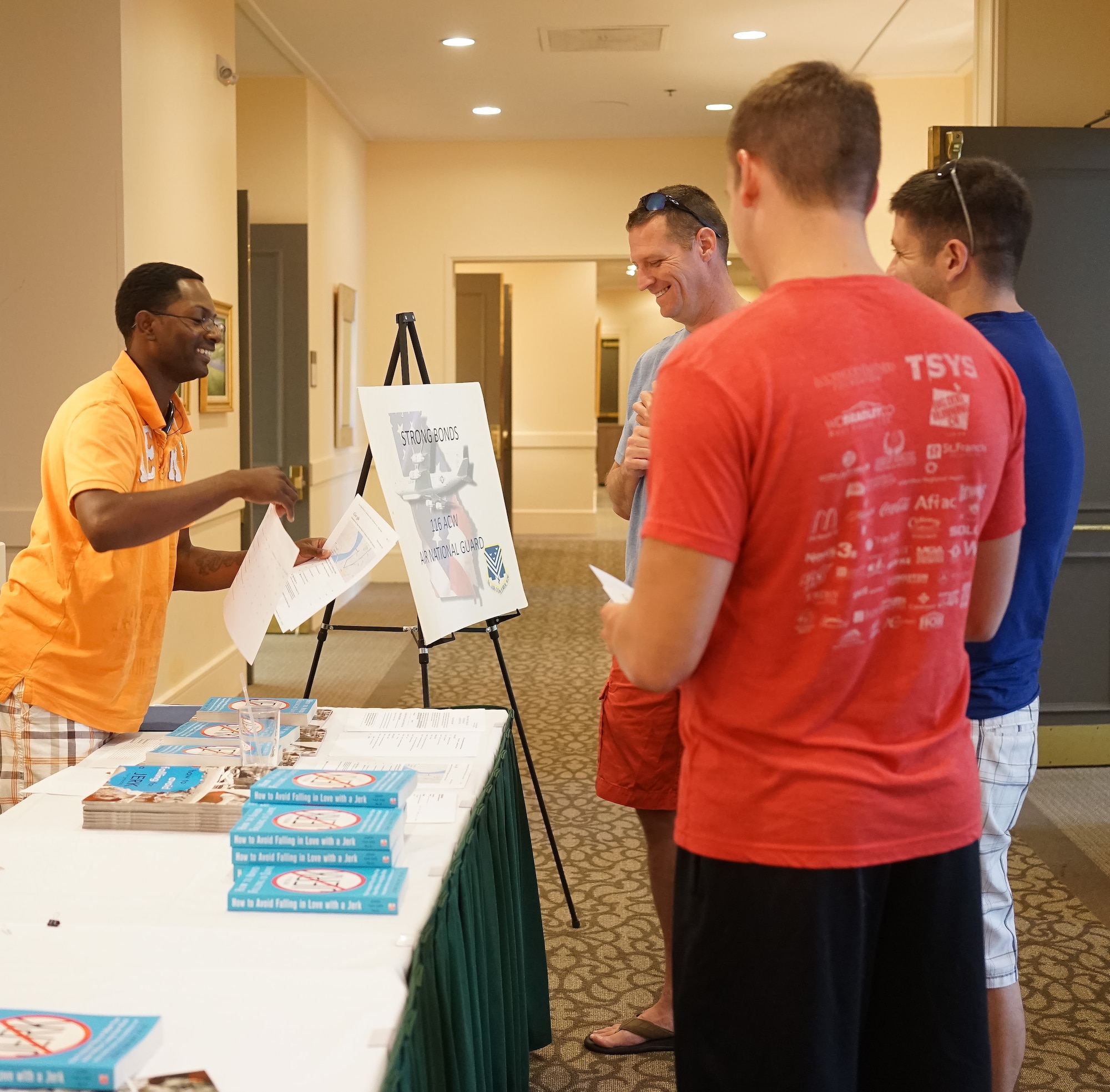 U.S. Air Force Technical Sgt. Steven Battle, 116th Air Control Wing chaplains assistant, Georgia Air National Guard, assists Airmen arriving for the Strong Bonds singles retreat at the Sea Palms Resort, Saint Simons Island, Ga., June 26, 2015. The retreat, hosted by chaplains from the 116th Air Control wing, is a key component of the unit's resiliency program aimed at helping Airmen from Air National Guard units across Georgia to build relationships, learn to trust people, and hone their teambuilding skills. (U.S. Air National Guard photo by Senior Master Sgt. Roger Parsons/Released)