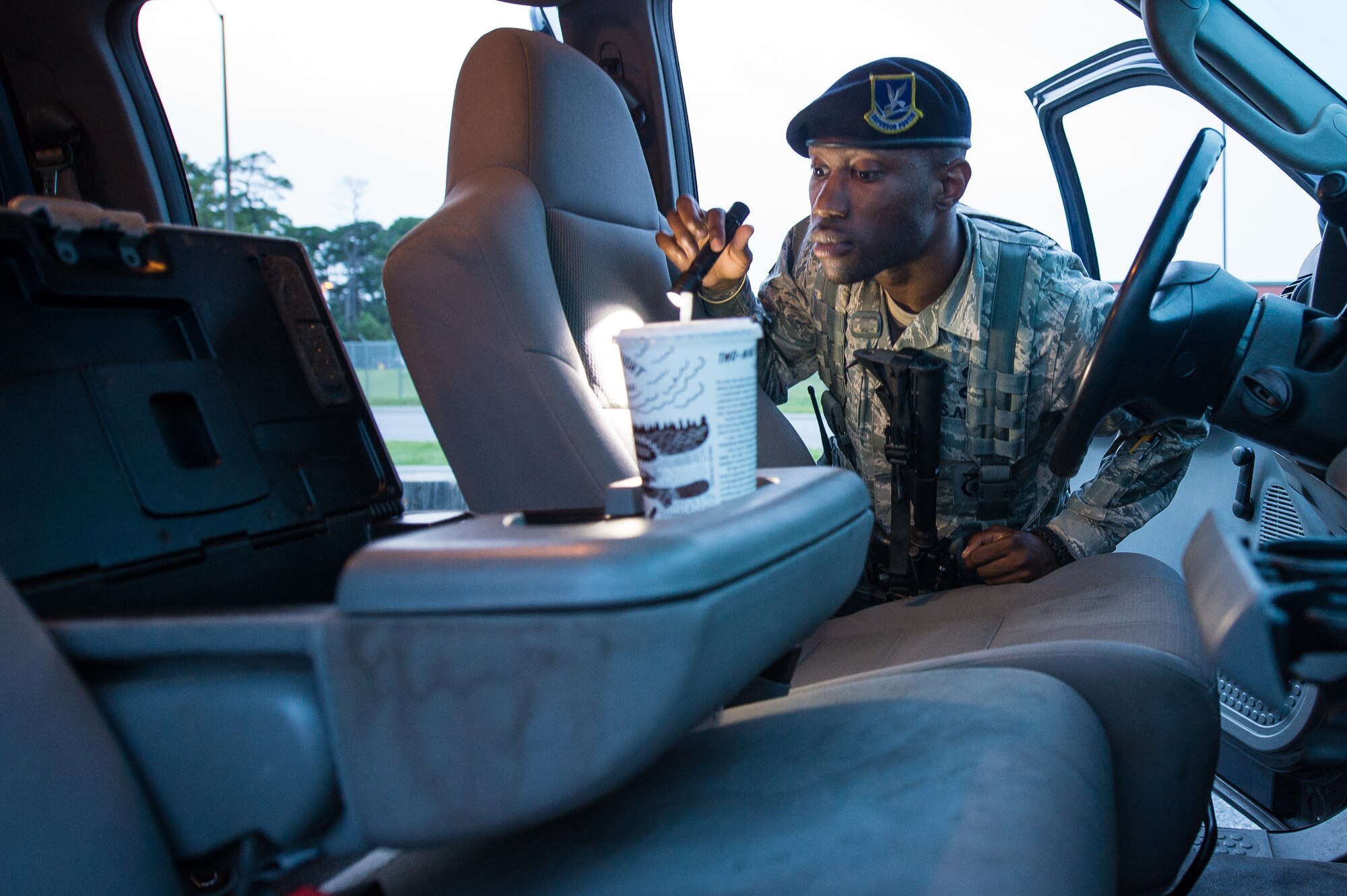 U.S. Air Force Senior Airman Bryson Polhill, 116th Security Forces Squadron, Georgia Air National Guard, searches a simulated suspicious vehicle for drugs during a training exercise at Joint Base Savannah, Ga., June 24, 2015. The JSTARS cops from the Georgia Air National Guard’s 116th Air Control Wing completed 15 days of law enforcement and flightline security training during their annual tour at Joint Base Savannah. During the training, the security forces Airmen responded to multiple simulated security threats each day and played the role of both cops and aggressors under the watchful eye of evaluators from the unit. (U.S. Air National Guard photo by Senior Master Sgt. Roger Parsons/Released)