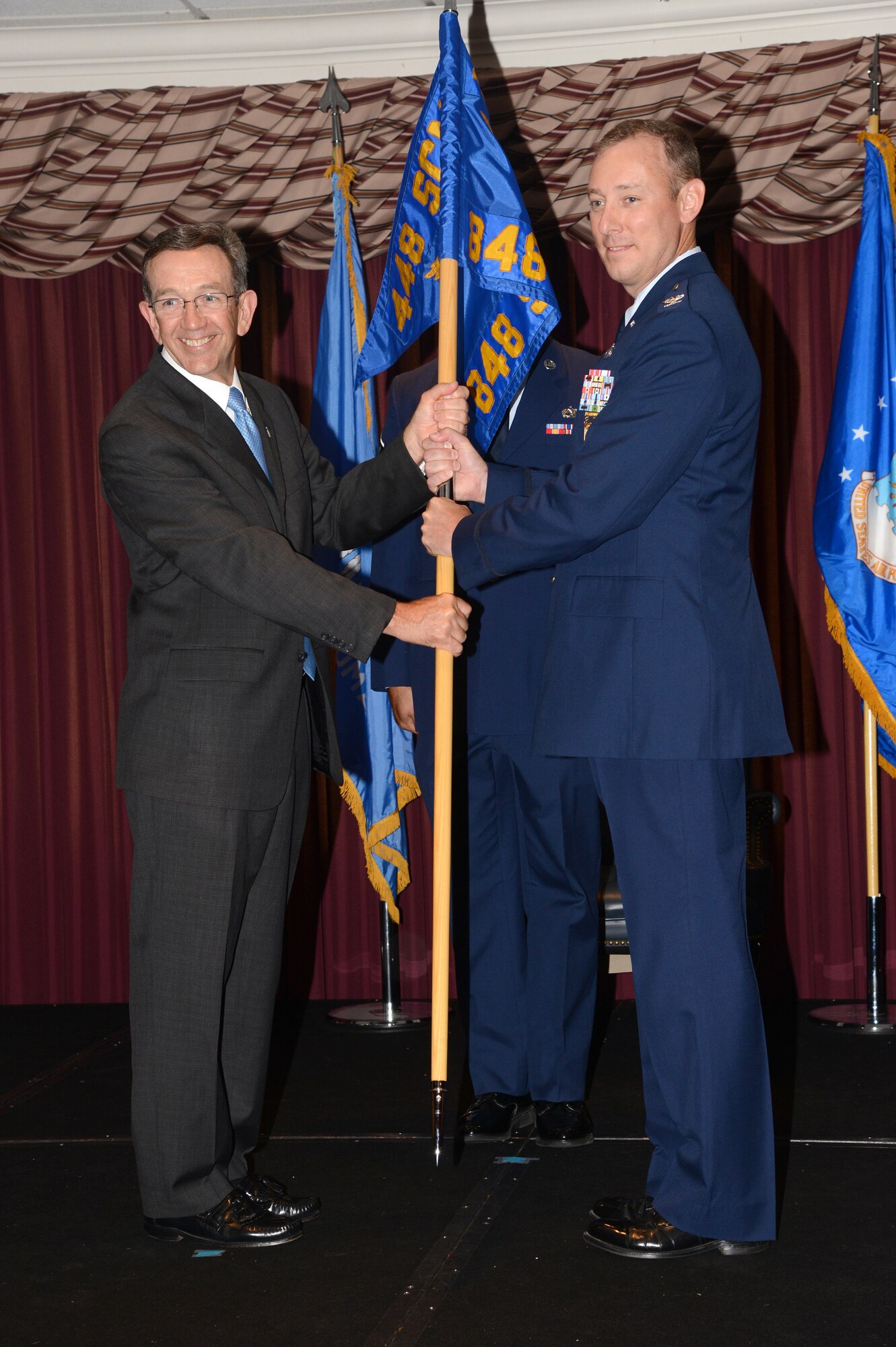 During a June 25 Change of Command ceremony at the Tinker Club, Col. William “Will” Roberts assumed command of the 848th Supply Chain Management Group. Frank Washburn, director of the 448th Supply Chain Management Wing, was the presiding officer. (Air Force photo by Kelly White/Released)