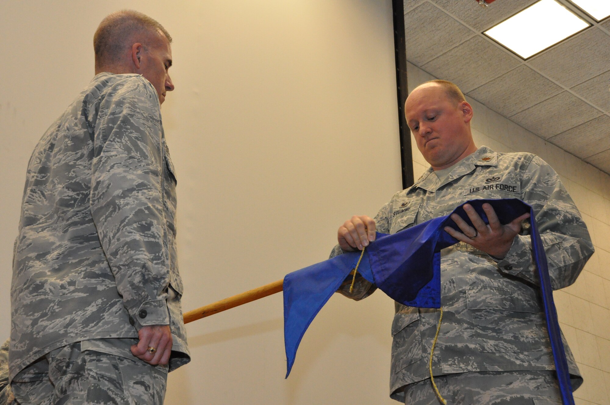 Maj. Luke Stumme, commander of 459th CES, encases the 459th CES guidon during the squadron's inactivation ceremony held at Joint Base Andrews, Md., June 6, 2015. Col. Roger Stoeckmann, 459 Mission Support Group commander, presided over the ceremony. The official inactivation commenced June 30, 2015. (Air Force Photo / Tech. Sgt. Brent Skeen)