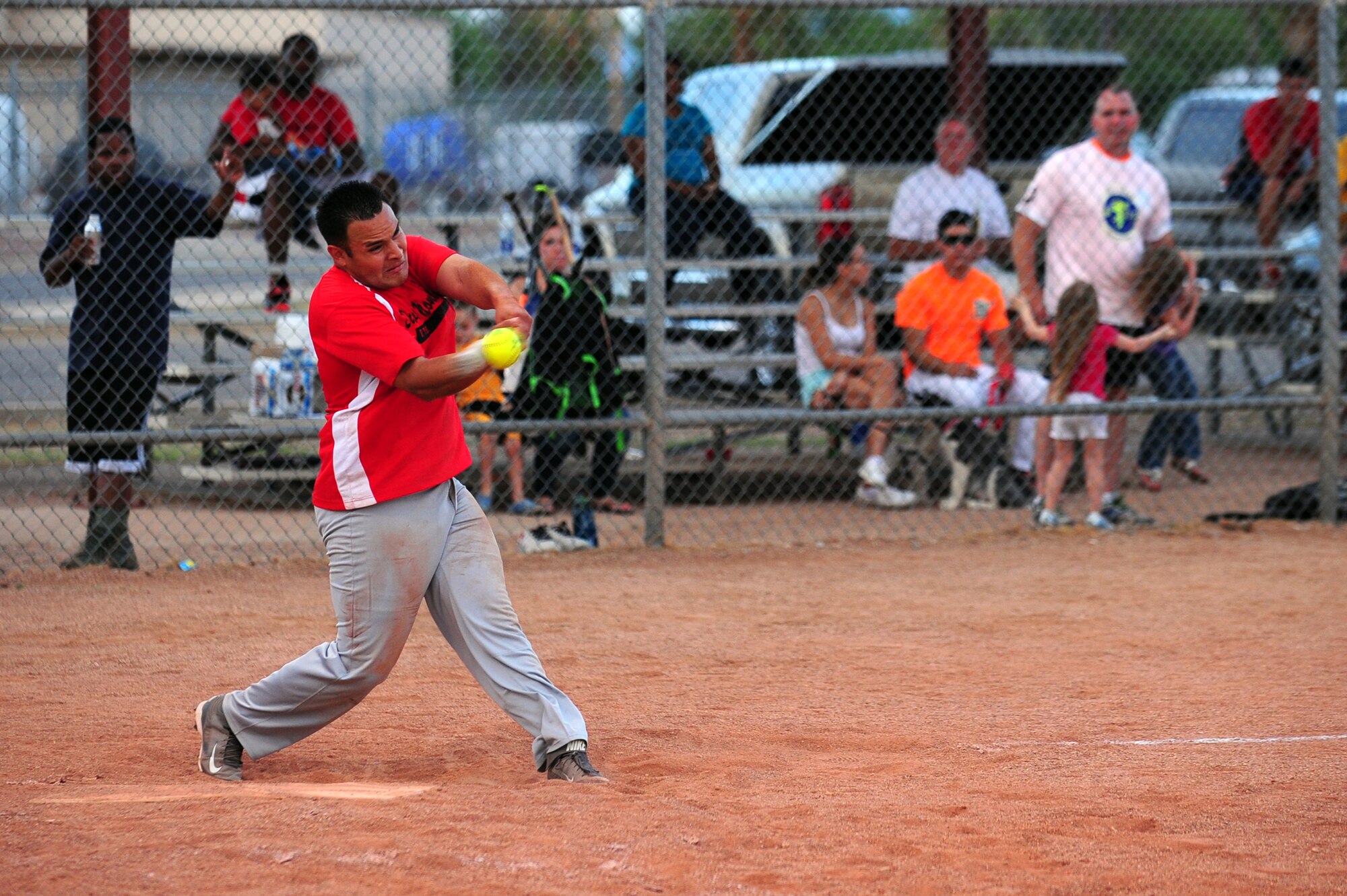 U.S. Air Force Staff Sgt. Cory Gonzales, 355th Civil Engineering Squadron firefighter, gets a base hit during extra innings that lead to the game winning run of the Intramural Softball Championship game at Davis-Monthan Air Force Base Ariz., July 1, 2015. The 355th CES was down six runs in the fourth inning and came back to defeat the 355th Equipment Maintenance Squadron 13-12. (U.S. Air Force photo by Airman 1st Class Chris Drzazgowski/Released)