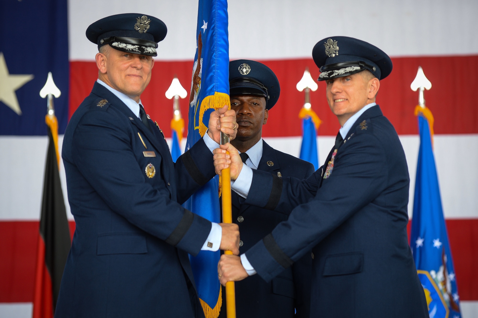 Lt. Gen. Timothy M. Ray, Third Air Force and 17th Expeditionary Air Force incoming commander, takes the guidon from, Gen. Frank Gorenc, U.S. Air Forces in Europe and U.S. Air Forces Africa commander July 2, 2015, at Ramstein Air Base, Germany.  It is military tradition that a guidon is exchanged between commanders to symbolize the passing of command. (U.S. Air Force photo/Senior Airman Nicole Sikorski)