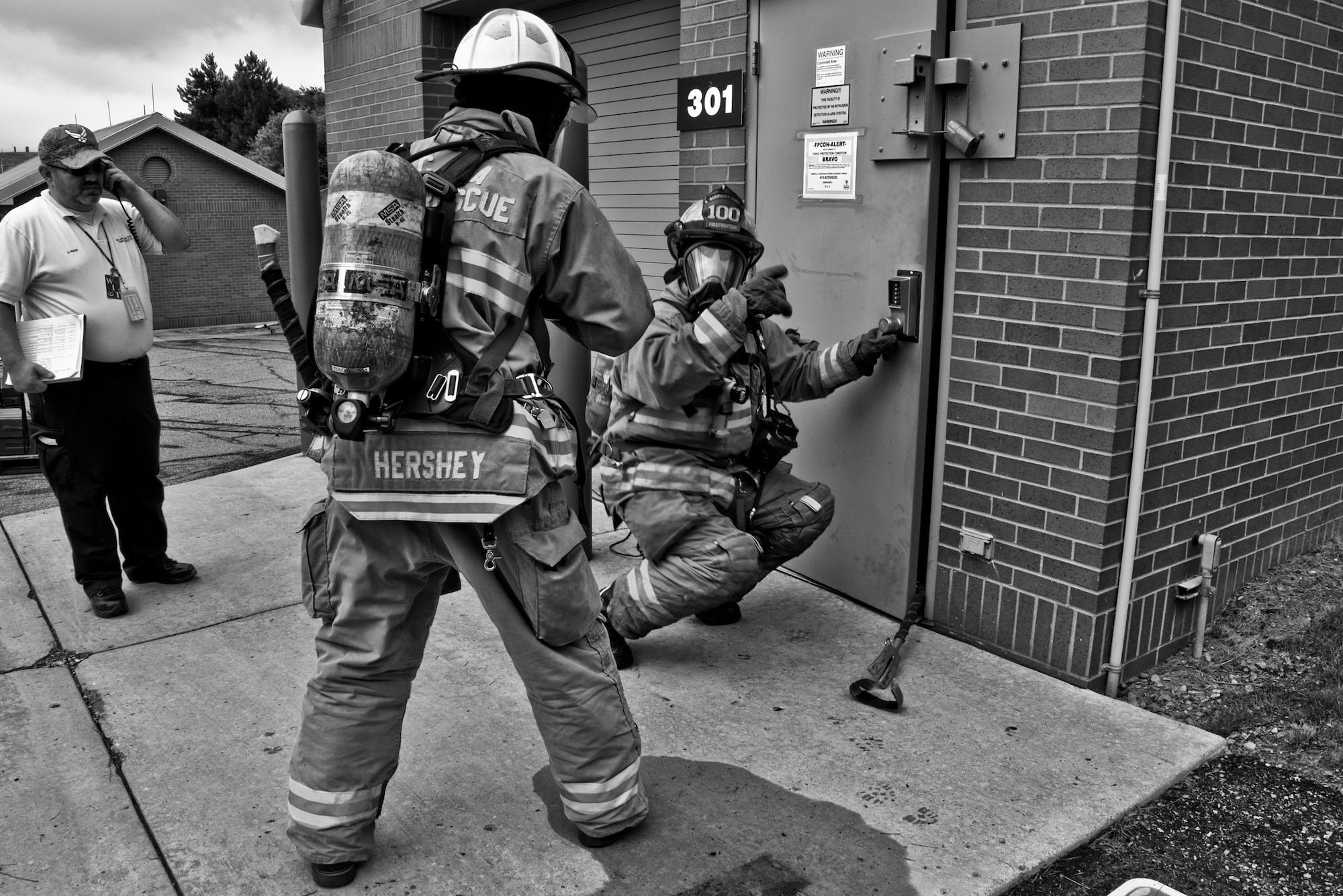 Allegheny County Airport Authority firefighters prepare to enter a simulated burning building during a Major Accident Response Exercise held at Pittsburgh International Airport Air Reserve Station, Pa, June 30, 2015. The MARE simulated lightning striking a building on base, catching it on fire and tested the response time of emergency crews. (U.S. Air Force photo by Senior Airman Joshua J. Seybert)