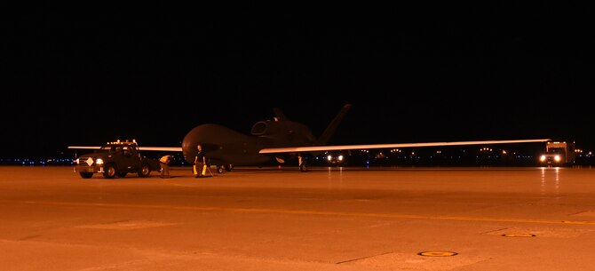An RQ-4 Global Hawk is towed off the runway after landing at Misawa Air Base, Japan, July 2, 2015. This is one of several Global Hawks to arrive at Misawa for a summer to winter rotation. The aircraft will begin local area checks before its first operational flight in early July. (U.S. Air Force photo by Staff Sgt. Alyssa C. Gibson)