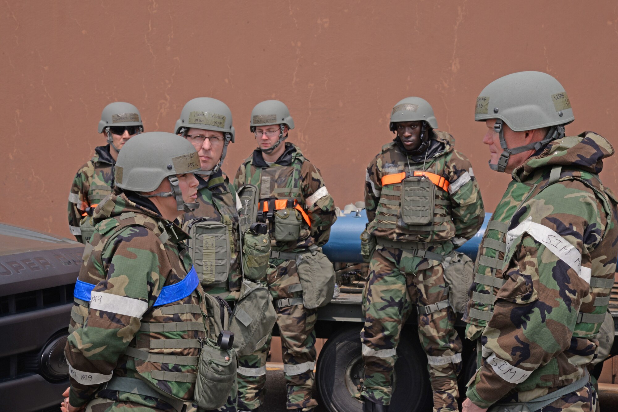 Chief Master Sgt. of the Air Force James Cody, discusses simulated chemical environmental operations with members of the 51st Maintenance Group July 2, 2015, at Osan Air Base, Republic of Korea. Cody donned his own set of Mission Oriented Protective Posture gear along with the Airmen. (U.S. Air Force photo by Staff Sgt. Benjamin Sutton/Released)
