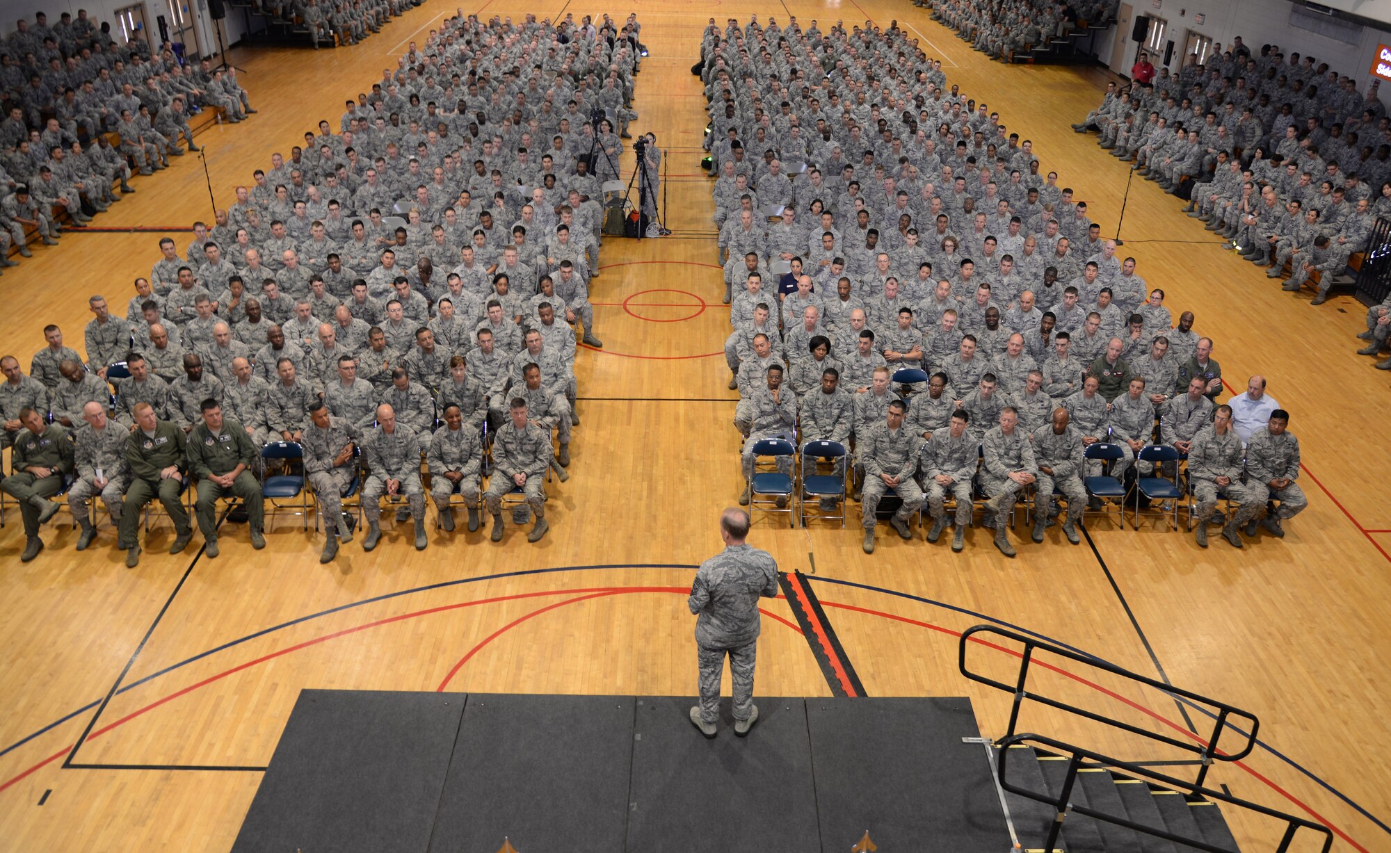 Chief Master Sgt. of the Air Force James Cody, speaks to members of Team Osan at an all call July 2, 2015, at Osan Air Base, Republic of Korea. As the Air Force's highest ranking enlisted Airman, Cody used the all call as an opportunity to share his insight about the USFK/ROK partnership, force management, the launch of the new enlisted performance reports, and other concerns. (U.S. Air Force photo by Staff Sgt. Benjamin Sutton/Released)