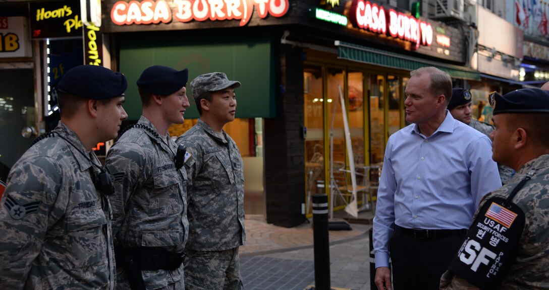 Chief Master Sgt. of the Air Force James Cody, the Air Force's highest ranking enlisted Airman, speaks with members from the 51st Security Forces Squadron town patrol July 1, 2015, outside Osan Air Base, Republic of Korea. Cody spent the day personally thanking the Airmen and getting a first-hand look at some of the unique aspects of living in Korea. (U.S. Air Force photo by Staff Sgt. Benjamin Sutton/Released)