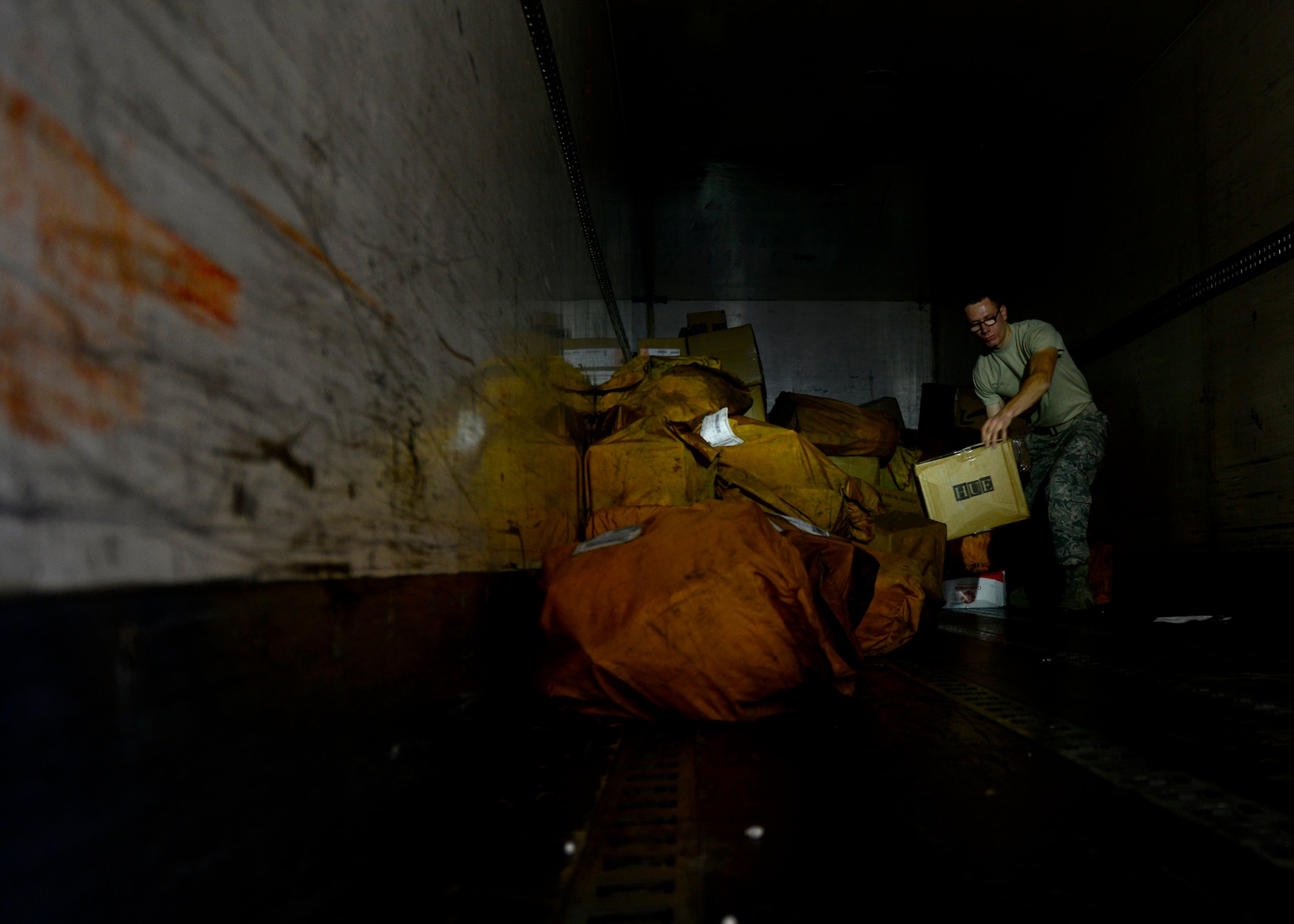 U.S. Air Force Airman 1st Class Mathew Brown, 31st Communications Squadron postal clerk, unloads mail from a truck, July 1, 2015, at Aviano Air Base, Italy. The 30-man office processes mail received for more than 8,000 customers. (U.S. Air Force photo by Senior Airman Areca T. Wilson/Released)