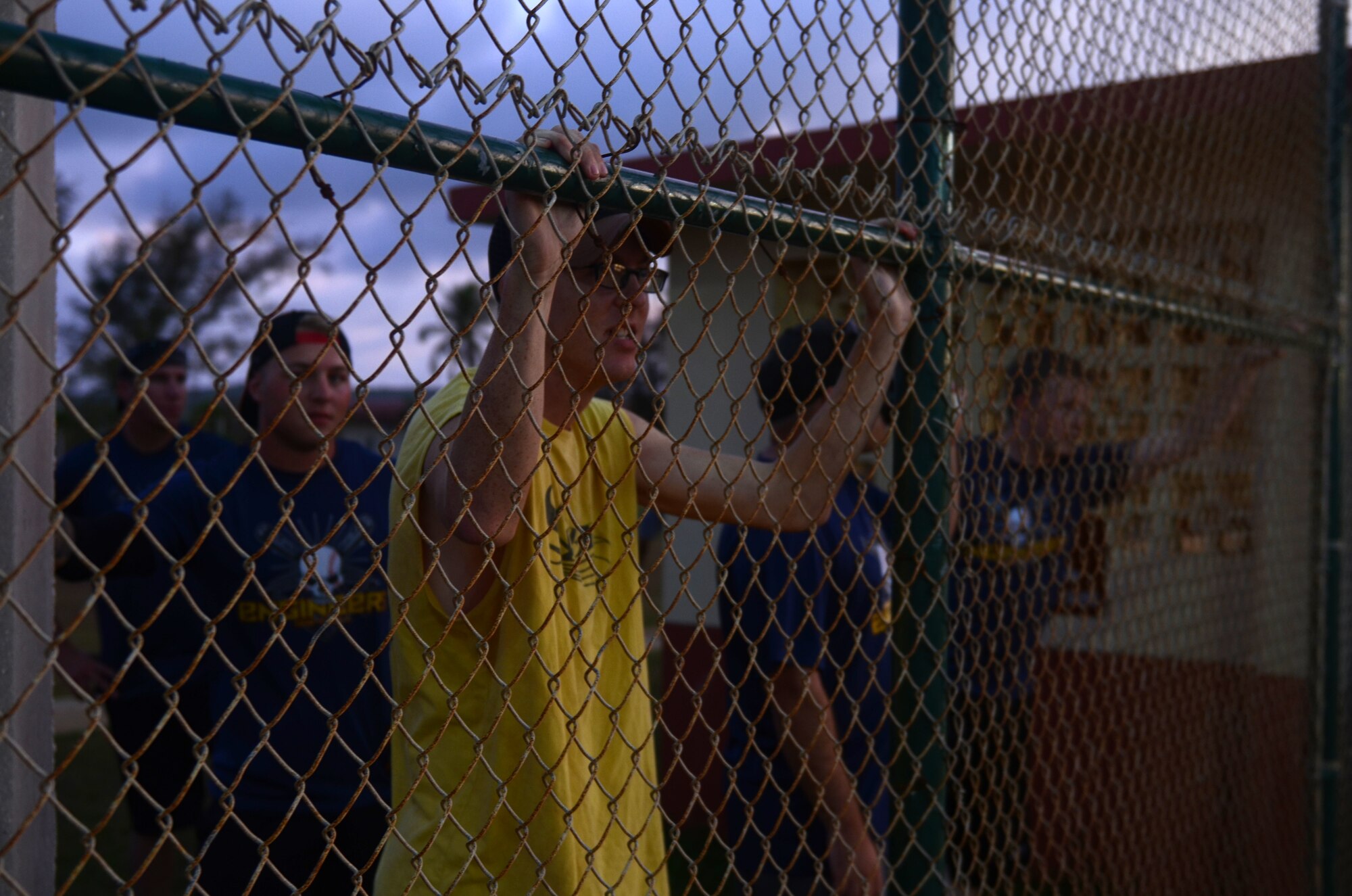 Spectators watch an intramural softball game between the 36th Medical Operations Squadron and 36th Contracting Squadron July 1, 2015, at Andersen Air Force Base, Guam. The 36th CS won the game with a final score of 19-17.  (U.S. Air Force photo by Airman 1st Class Alexa Ann Henderson/Released)