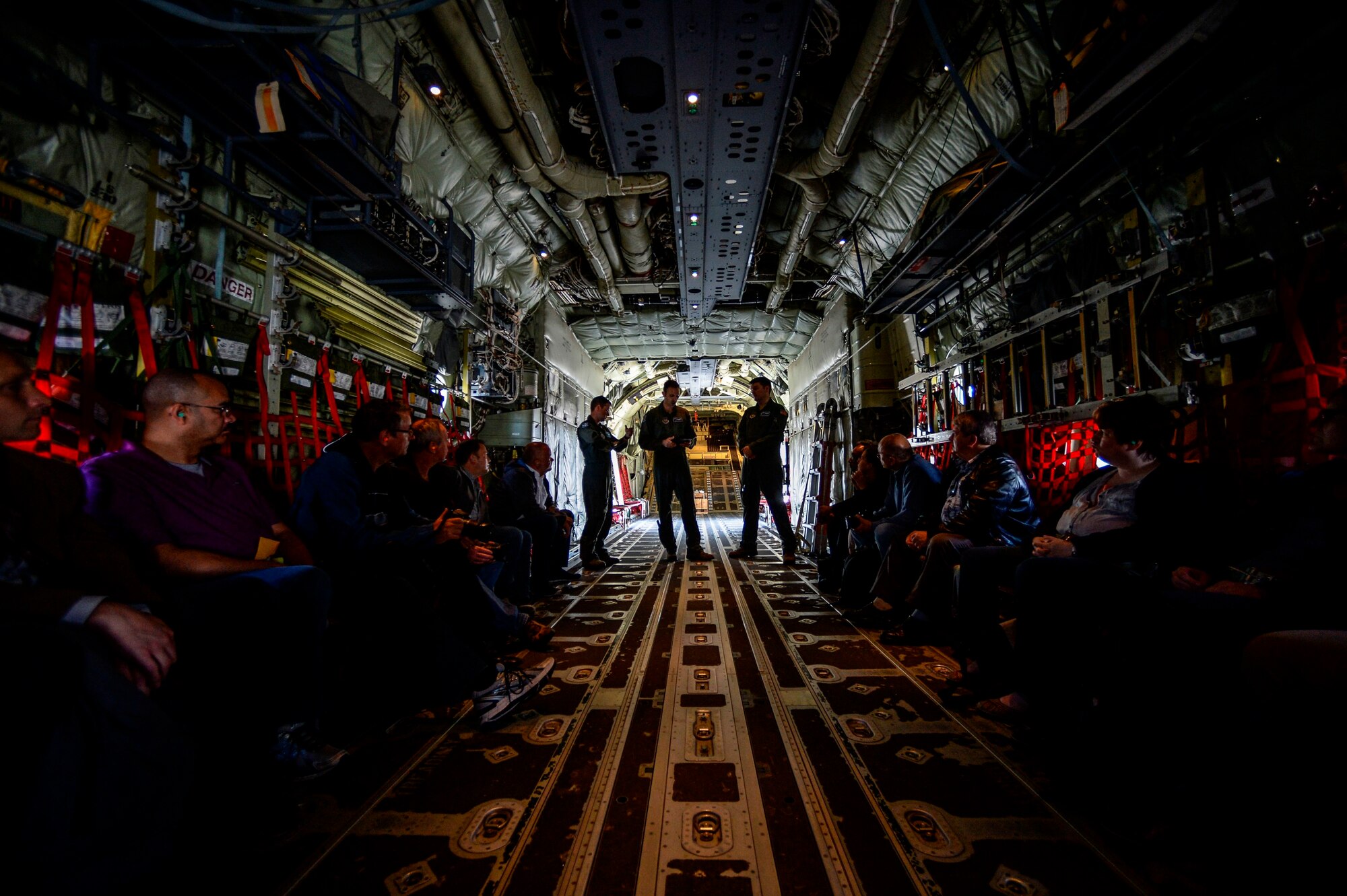 Capts. Jonathan Recor and Sean McKee, C-130J Super Hercules pilots assigned to the 37th Airlift Squadron, brief German local nationals before an orientation flight June 29, 2015, at Ramstein Air Base, Germany. Recor and Mckee briefed safety procedures and what to do in case of flight sickness. (U.S. Air Force photo/Senior Airman Nicole Sikorski)