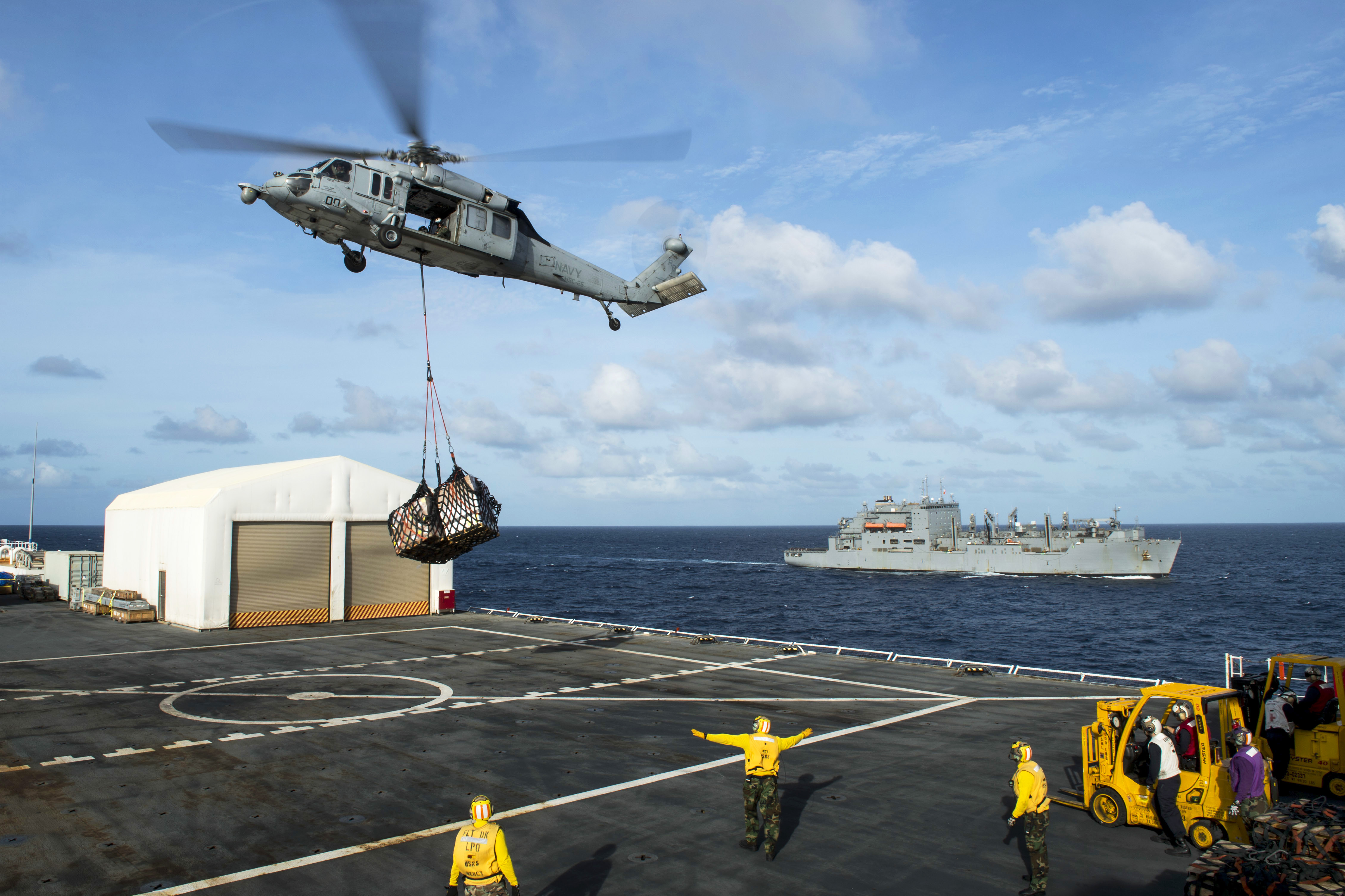 A Navy MH 60S Seahawk from Helicopter Sea Combat Squadron 25 delivers