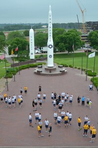OFFUTT AIR FORCE BASE, Neb. (July 2, 2015) Personnel assigned to U.S. Strategic Command (USSTRATCOM) headquarters on Offutt Air Force Base, Neb. gather on the missile deck prior to a command fun run, July 2, 2015. USSTRATCOM is one of nine DoD unified combatant commands and is charged with strategic deterrence; space operations; cyberspace operations; joint electronic warfare; global strike; missile defense; intelligence, surveillance and reconnaissance; combating weapons of mass destruction; and analysis and targeting. (USSTRATCOM photo by Mass Communication Specialist 1st Class Byron C. Linder/Released)