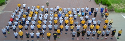 OFFUTT AIR FORCE BASE, Neb. (July 2, 2015) Personnel assigned to U.S. Strategic Command (USSTRATCOM) headquarters on Offutt Air Force Base, Neb. gather in formation prior to a command fun run, July 2, 2015. USSTRATCOM is one of nine DoD unified combatant commands and is charged with strategic deterrence; space operations; cyberspace operations; joint electronic warfare; global strike; missile defense; intelligence, surveillance and reconnaissance; combating weapons of mass destruction; and analysis and targeting. (USSTRATCOM photo by Mass Communication Specialist 1st Class Byron C. Linder/Released)