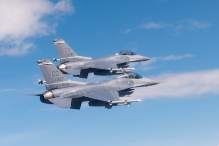 Two F-16 Fighting Falcons from the 120th Fighter Squadron, 140th Wing, Colorado Air National Guard, fly over the Denver-Metro area May 29, 2015. (Air National Guard Photo by Tech. Sgt. Wolfram Stumpf)