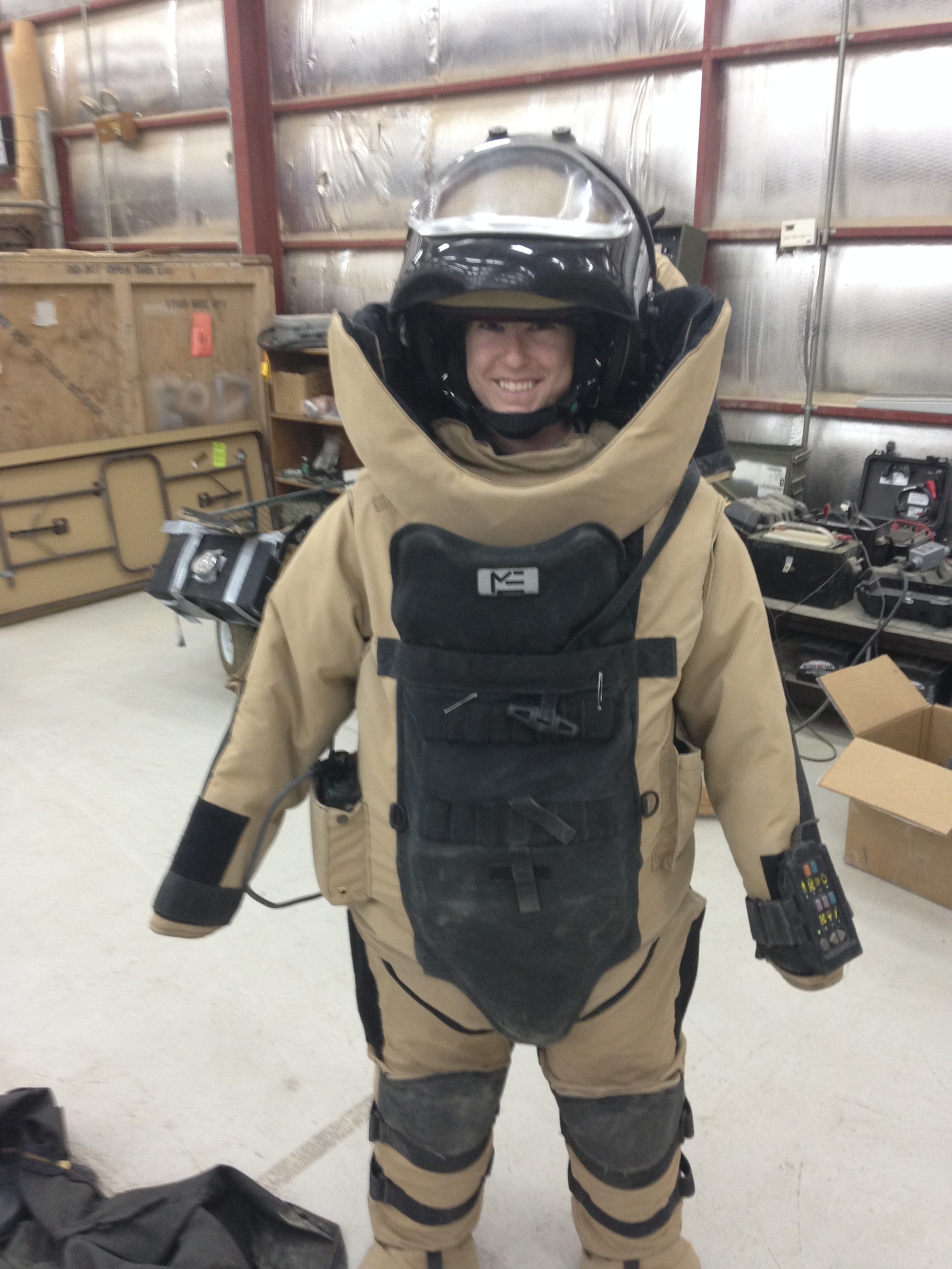 1st Lt Tawny Gardner wears an Explosive Ordinance bomb suit while interacting with the airmen from the 379th Expeditionary Civil Engineering Squadron May 12, 2015 at Al Udeid Air Base, Qatar. Gardner was awarded the 2015 Sexual Assault Prevention and Response innovation award recently by the Department of Defense for her program while deployed to Al Udeid Air Base. (Courtesy Photo)