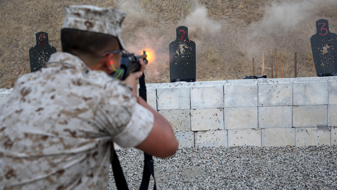 Pfc. Caston Mai, an administrative clerk with Headquarters and Headquarters Squadron and an Arlington, Texas, native, shoots the M1014 shotgun during security augment force training at Marine Corps Air Station Miramar, California, June 30. During the course, trainees learn arrest techniques and defensive tactics.