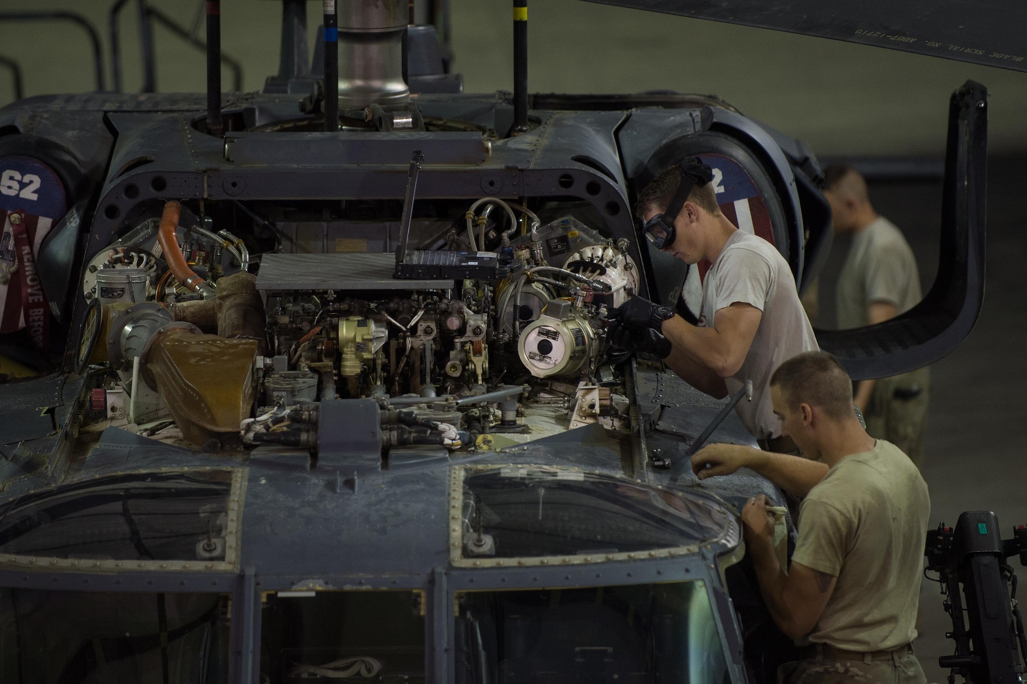 Airmen assigned to the 41st Expeditionary Helicopter Maintenance Unit work to complete a 50-hour inspection on a HH-60 Pave Hawk at Bagram Airfield, Afghanistan, June 28, 2015. The 41st EHMU ensures Pave Hawks on Bagram Airfield are prepared for flight and returned to a mission-ready state once they land. (U.S. Air Force photo/Tech. Sgt. Joseph Swafford)