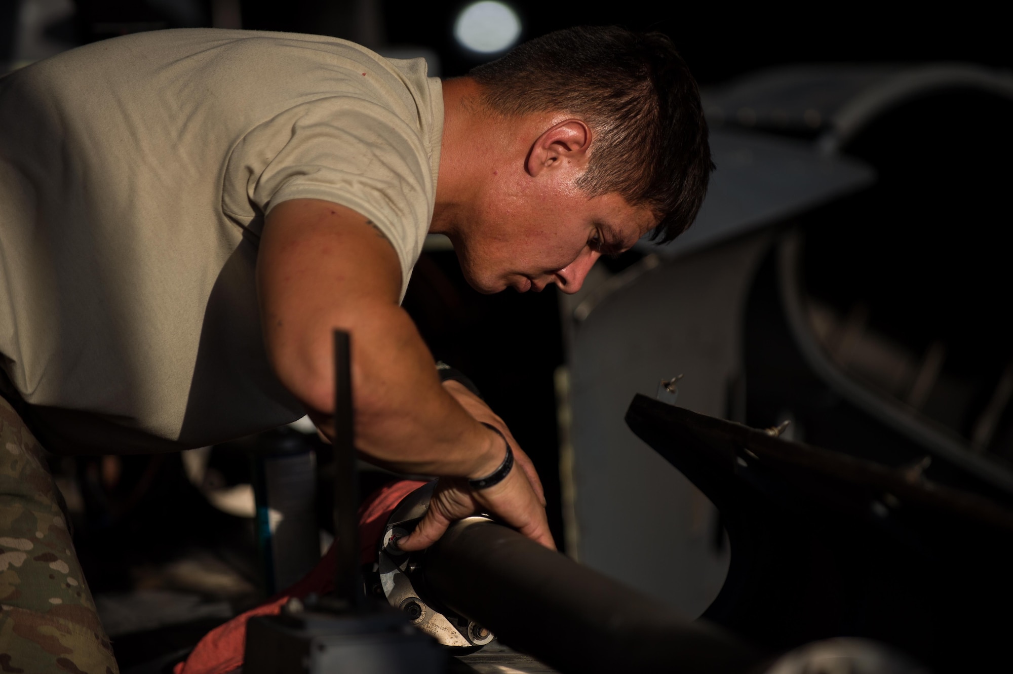 Staff Sgt. Michael Morris, a 41st Expeditionary Helicopter Maintenance Unit HH-60 Pave Hawk crew chief, completes a 50-hour inspection on a Pave Hawk at Bagram Airfield, Afghanistan, June 28, 2015. The 41st EHMU ensures Pave Hawks on Bagram Airfield are prepared for flight and returned to a mission-ready state once they land. (U.S. Air Force photo/Tech. Sgt. Joseph Swafford)