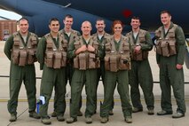 A 96th Bomb Squadron B-52H aircrew poses for a photo at Barksdale Air Force Base, La., following a 44-hour nonstop sortie July 2, 2015. Two B-52H Stratofortress bombers and aircrews from the 96 BS flew a round-trip mission from Barksdale to Australia, demonstrating the United States’ ability to project a flexible, long-range global strike capability. During the mission, aircrews integrated with Royal Australian Air Force ground forces in the region, conducted an inert conventional weapons exercise on the Delamere Air Weapons Range, and performed a low approach at RAAF Base Tindal. U.S. Strategic Command, through its global strike assets, regularly conducts training with and in support of the geographic combatant commands to help maintain global stability and security, while enabling units to become familiar with operating in different regions of the world. (U.S. Air Force photo/Senior Airman Benjamin Raughton)