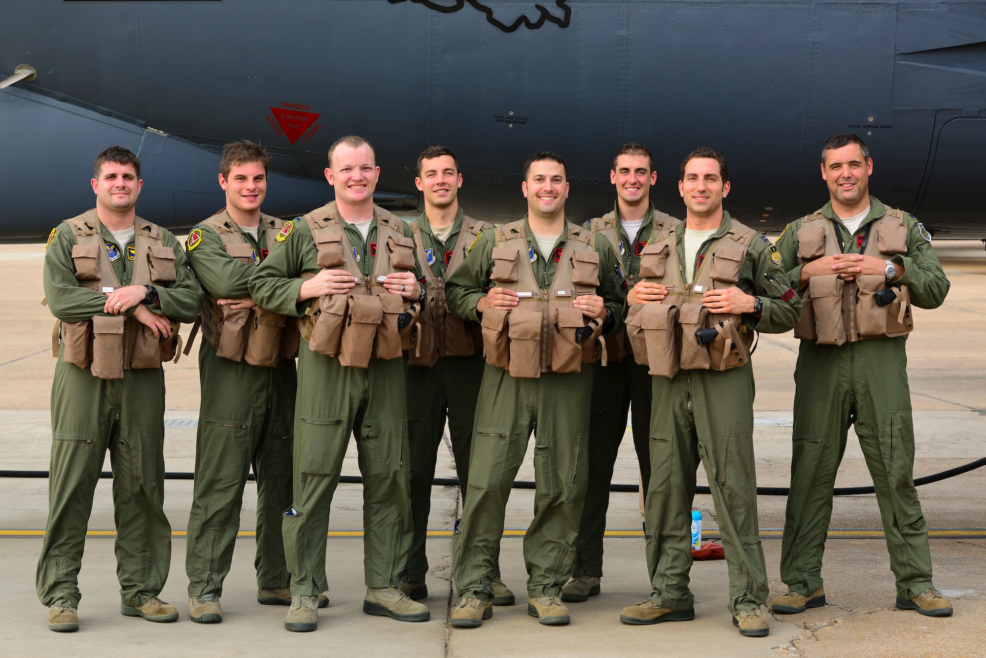 A 96th Bomb Squadron B-52H aircrew poses for a photo at Barksdale Air Force Base, La., following a 44-hour nonstop sortie July 2, 2015. Two B-52H Stratofortress bombers and aircrews from the 96 BS flew a round-trip mission from Barksdale to Australia, demonstrating the United States’ ability to project a flexible, long-range global strike capability. During the mission, aircrews integrated with Royal Australian Air Force ground forces in the region, conducted an inert conventional weapons exercise on the Delamere Air Weapons Range, and performed a low approach at RAAF Base Tindal. U.S. Strategic Command, through its global strike assets, regularly conducts training with and in support of the geographic combatant commands to help maintain global stability and security, while enabling units to become familiar with operating in different regions of the world. (U.S. Air Force photo/Senior Airman Benjamin Raughton)