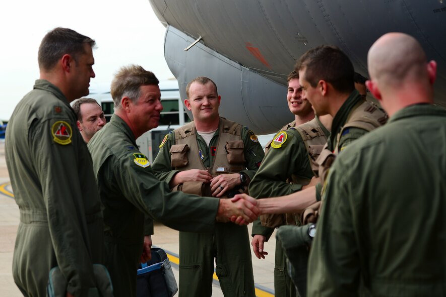 Col. Keith Schultz, 2nd Bomb Wing vice commander, welcomes B-52H Stratofortress aircrew members home to Barksdale Air Force Base, La., following a round-trip mission to Australia July 2, 2015. The 44-hour nonstop mission, which was closely coordinated with the Australian Department of Defence, provided unique opportunities to synchronize strategic activities and capabilities with a key ally in the U.S. Pacific Command area of operations. (U.S. Air Force photo/Senior Airman Benjamin Raughton)