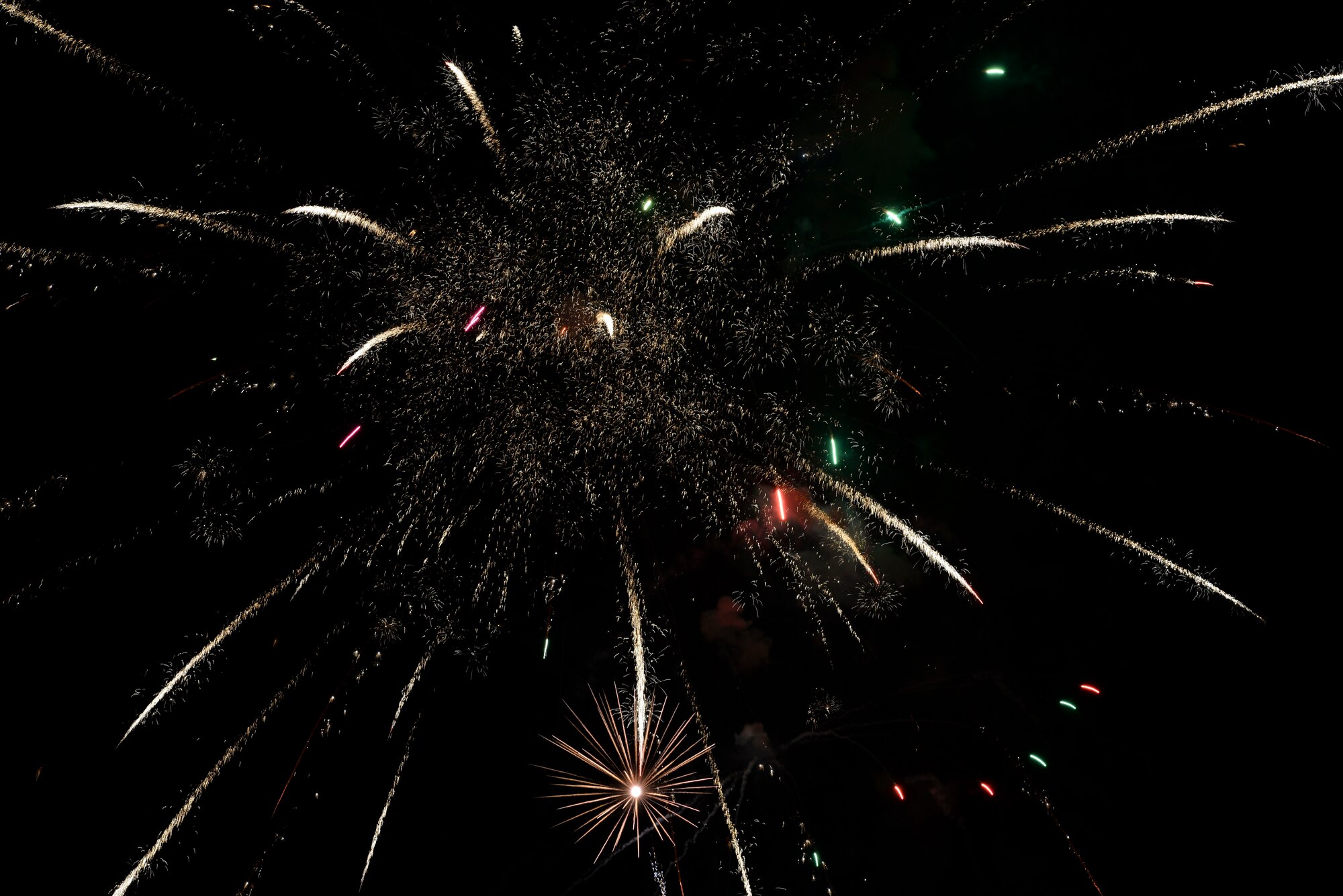 Fireworks are shot off during the Freedom Fest Independence Day celebration at Holloman Air Force Base, N.M., July 2, 2015. Freedom Fest took place in the Domenici Fitness and Sports Center parking lot and included carnival games, rides, and live music for Airmen and their families. (U.S. Air Force photo by Staff Sgt. E’Lysia A. Wray /Released)