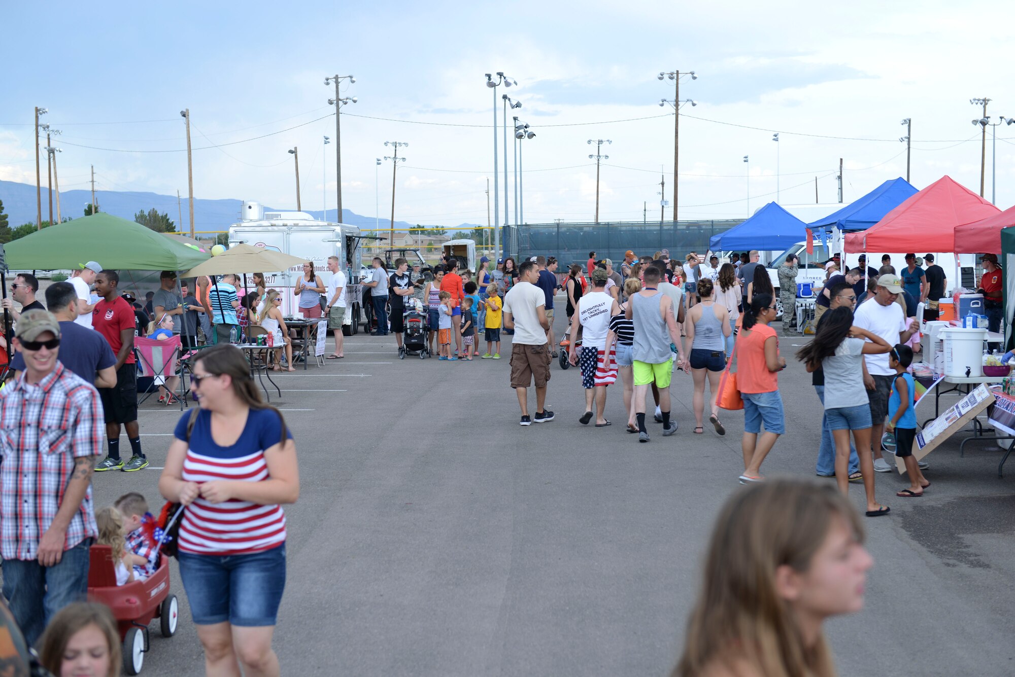 Members of Team Holloman gather for fun and festivities at this year’s Freedom Fest Independence Day celebration at Holloman Air Force Base, N.M., July 2, 2015. Families are encouraged to join the festivities during the celebration, which includes carnival games, live entertainment, food and a final firework show to end the night. (U.S. Air Force photo by Staff Sgt. E’Lysia A. Wray /Released)