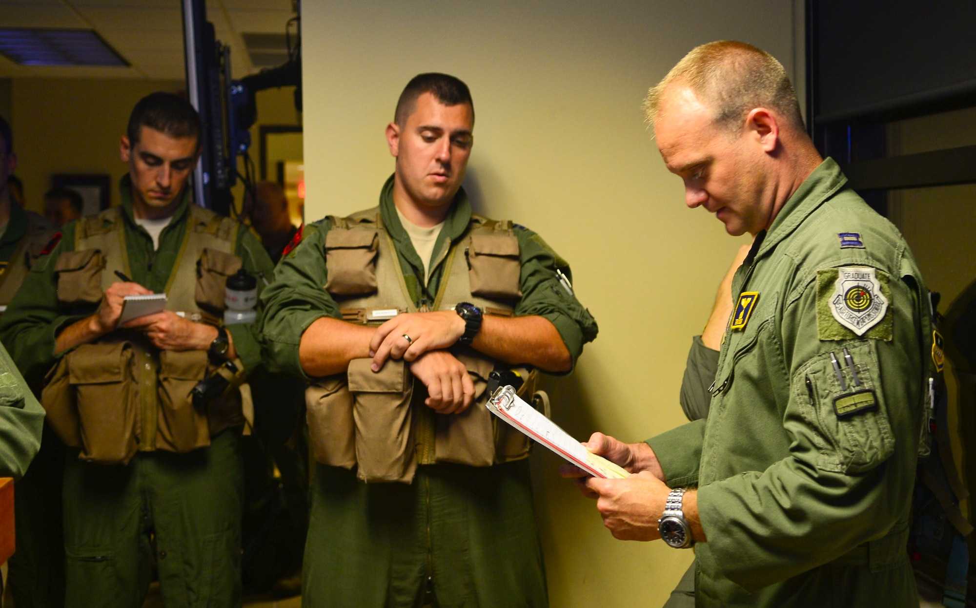 Capt. Eric Bow (right), the 2nd Operations Support Squadron Conventional Plans Flight commander, conducts a premission briefing with aircrew members at Barksdale Air Force Base, La., June 30, 2015. During the mission, two B-52H Stratofortresses flew round-trip to Australia, where they integrated with Royal Australian Air Force ground forces to conduct an inert conventional weapons exercise on the Delamere Air Weapons Range and performed a low approach at RAAF Base Tindal, Australia. (U.S. Air Force photo/Senior Airman Benjamin Raughton)