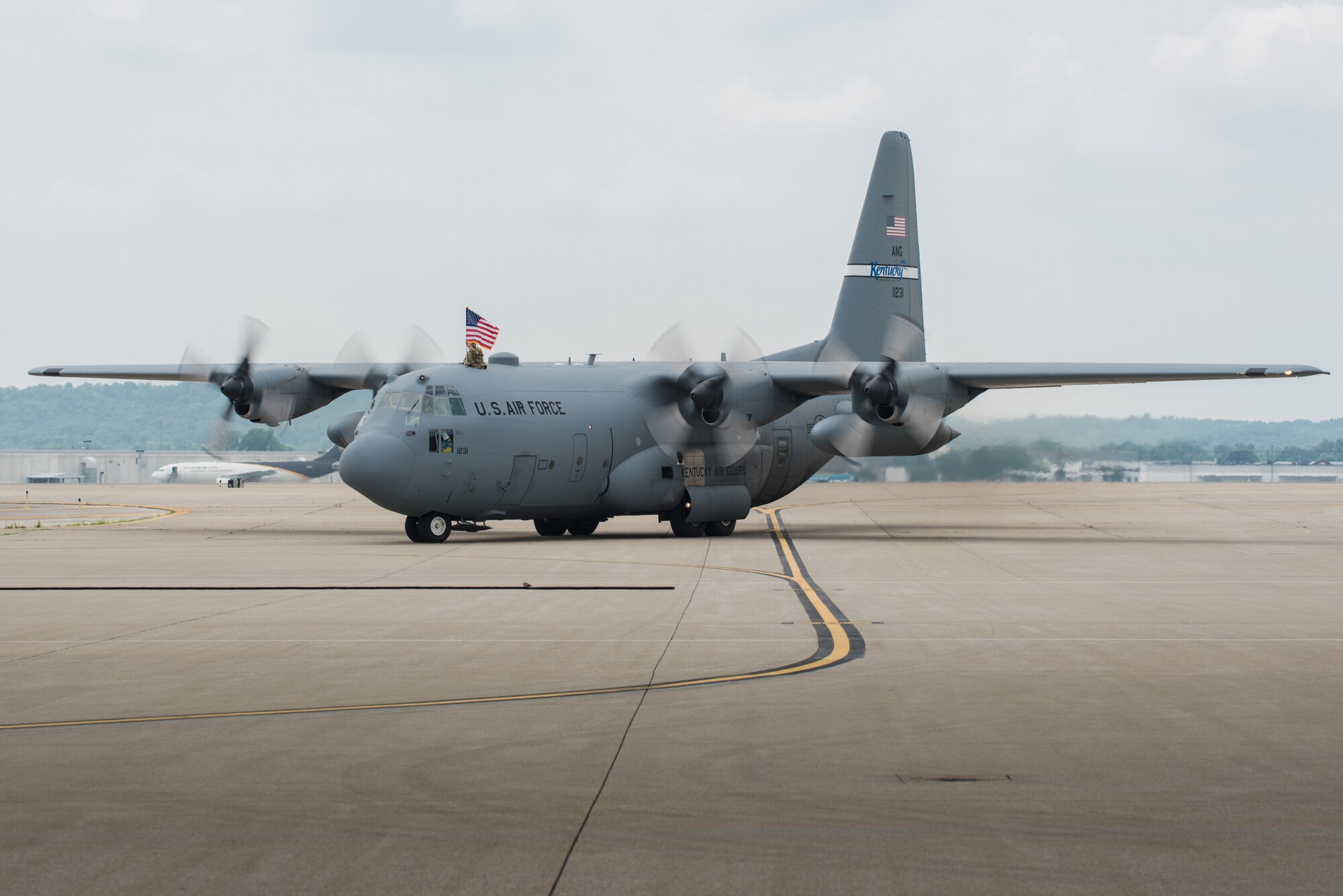 A C-130 Hercules aircraft taxies onto the flight line at the Kentucky Air National Guard Base in Louisville, Ky., July 4, 2015, carrying 39 Airmen returning from a deployment in the Persian Gulf region. The Kentucky Air Guard's 123rd Airlift Wing has been supporting Operation Freedom's Sentinel in the U.S. Central Command Area of Responsibility since February. (U.S. Air National Guard photo by Maj. Dale Greer)
