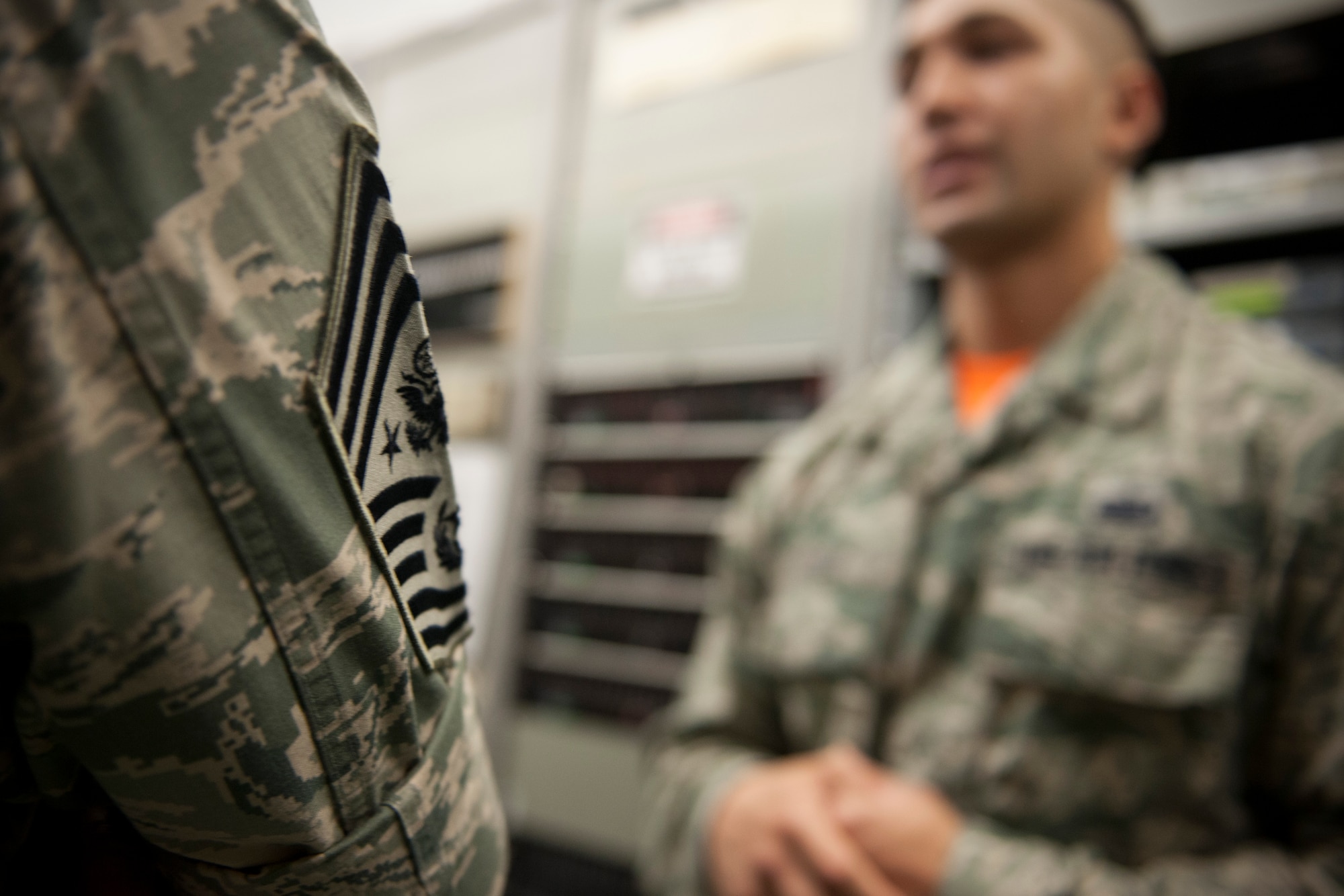 Chief Master Sgt. of the Air Force James A. Cody listens to Staff Sgt. Willie Lopez, 8th Communications Squadron technician, explain the role of the 8th CS during armistice and contingency operations July 3, 2015, at Kunsan Air Base, Republic of Korea. During his first visit to Kunsan, Cody had the opportunity to learn how the Wolf Pack contributes to deterring aggression on the Korean Peninsula, as well as discuss major changes impacting the total force during an All Call. (U.S. Air Force photo by Senior Airman Katrina Heikkinen/Released)