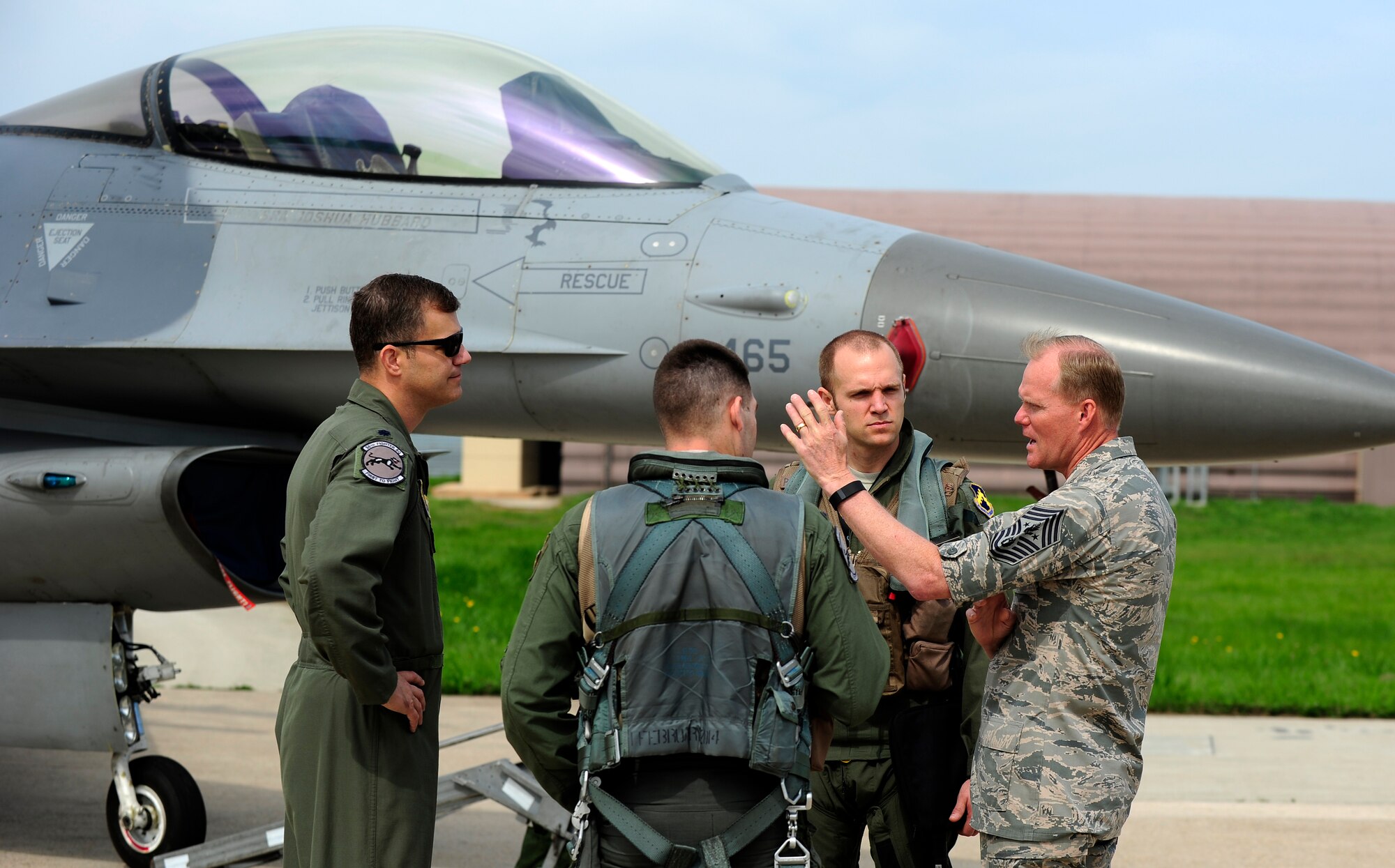 Chief Master Sgt. of the Air Force James A. Cody speaks with F-16 Fighting Falcon pilots from the 35th Fighter Squadron during a tour at Kunsan Air Base, Republic of Korea, July 2, 2015. Cody engaged with Wolf Pack Airmen to answer questions and give insight on key Air Force topics and changes. (U.S. Air Force photo by Staff Sgt. Nick Wilson/Released)
