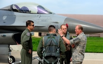 Chief Master Sgt. of the Air Force James A. Cody speaks with F-16 Fighting Falcon pilots from the 35th Fighter Squadron during a tour at Kunsan Air Base, Republic of Korea, July 2, 2015. Cody engaged with Wolf Pack Airmen to answer questions and give insight on key Air Force topics and changes. (U.S. Air Force photo by Staff Sgt. Nick Wilson/Released)